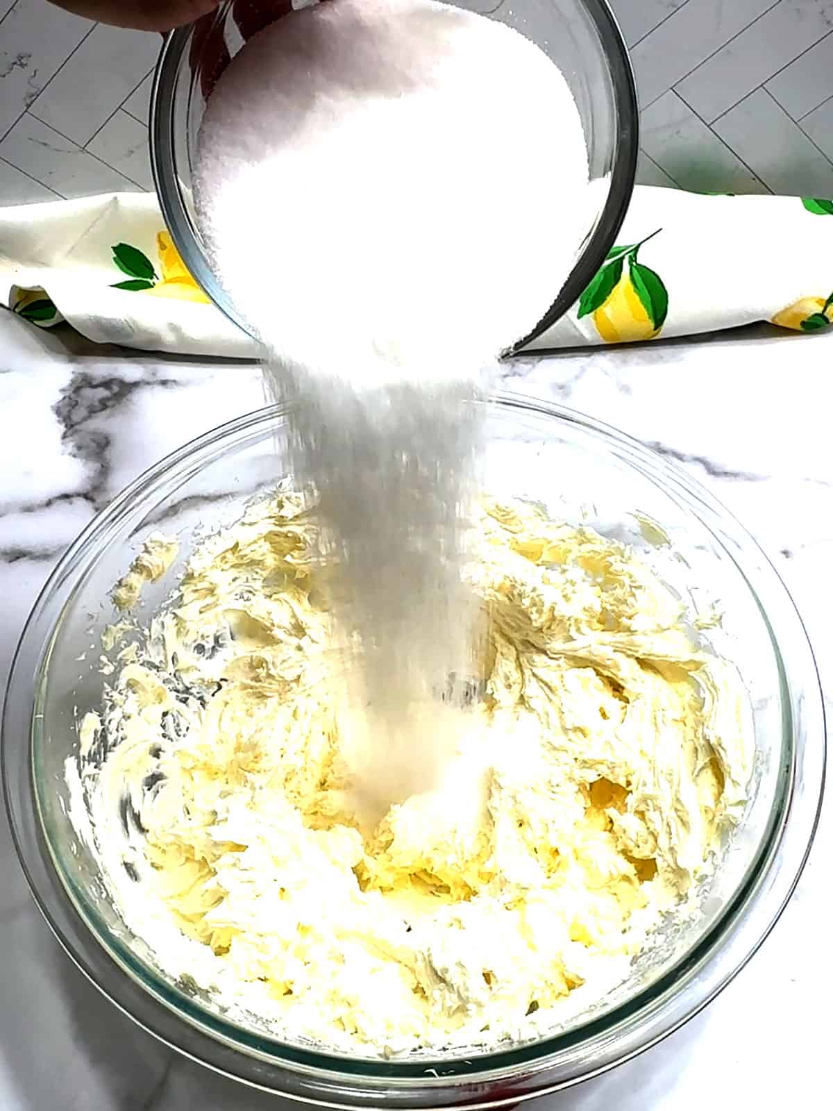 adding sugar for cheesecake filling