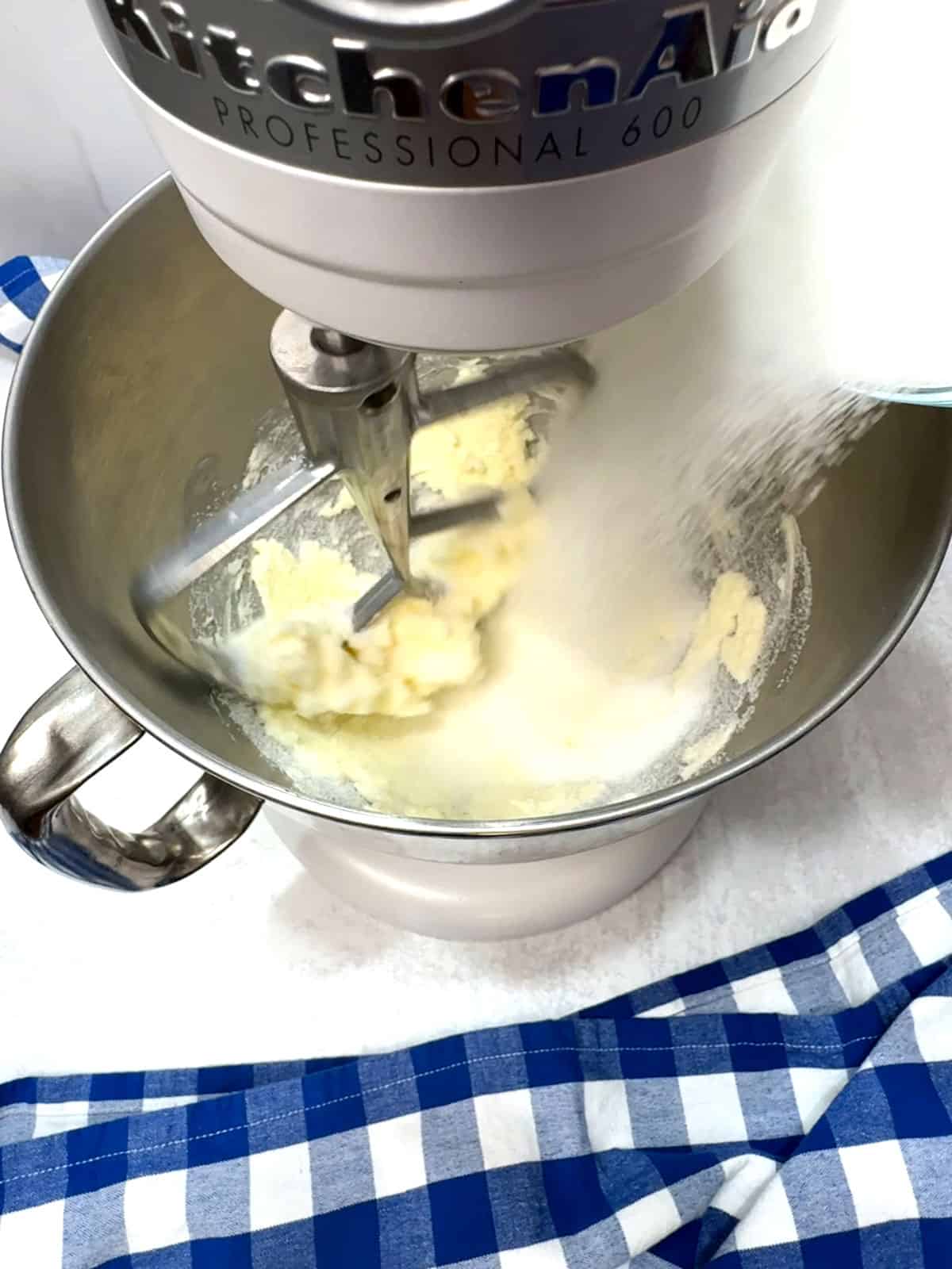 adding sugar for cake