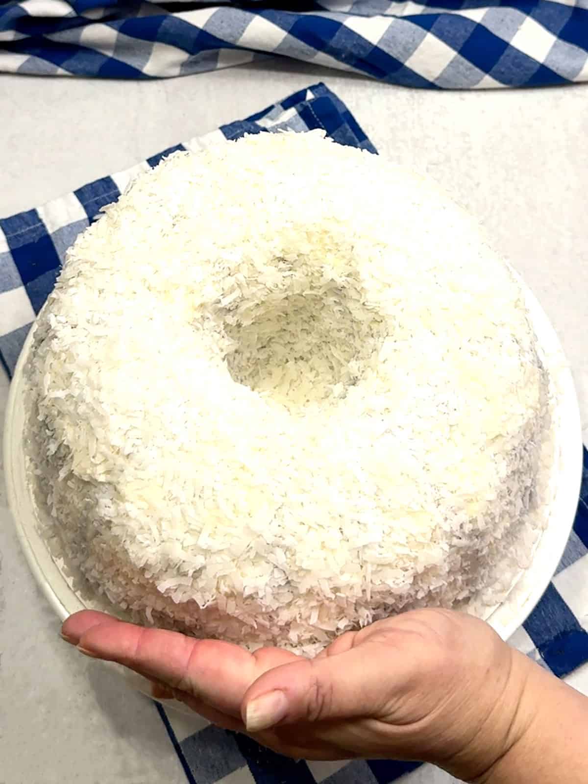 coating cake in coconut