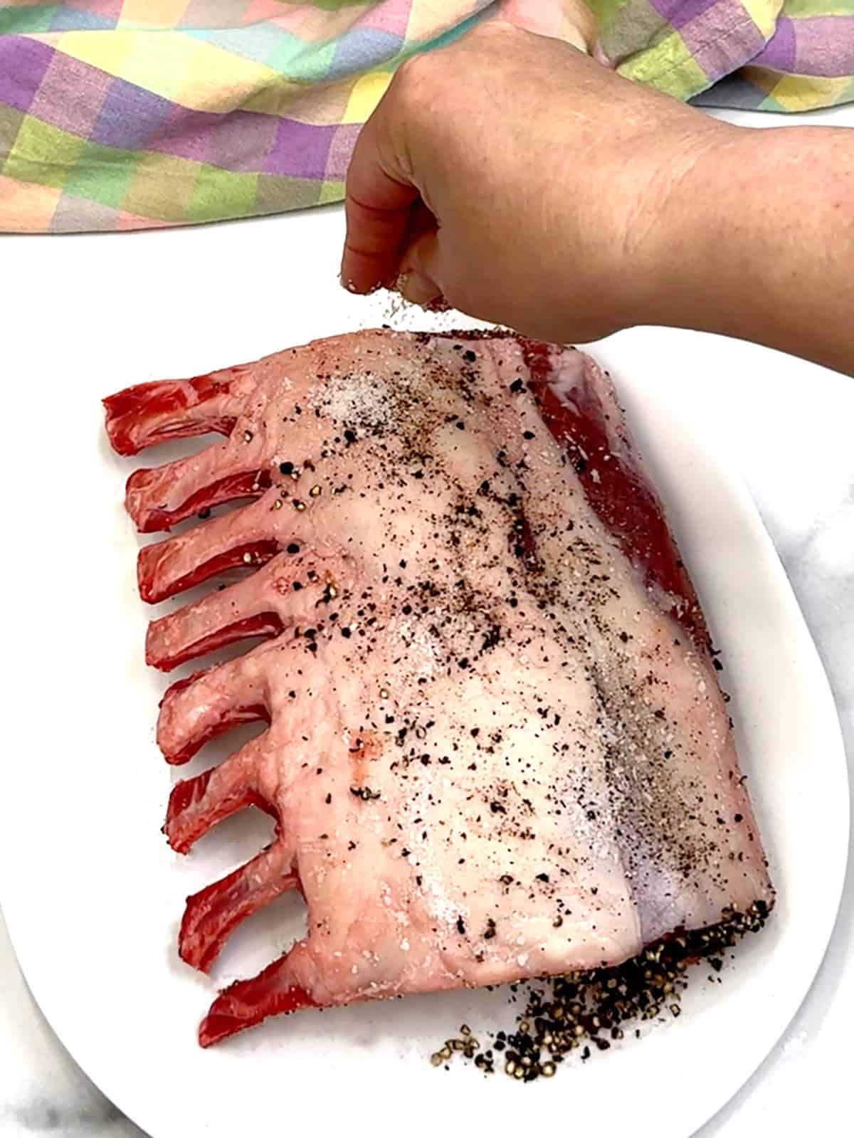 salt and pepper on lamb