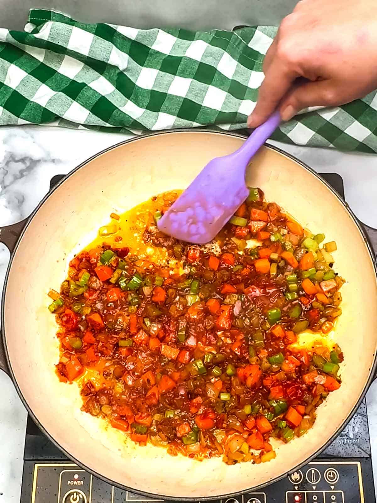 Stirring in the tomato paste