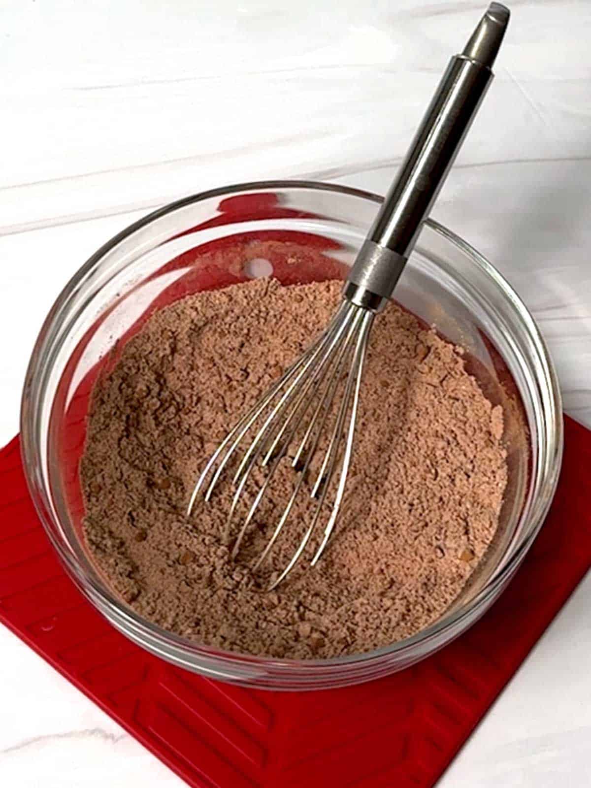 Dry ingredients whisked together in a bowl.