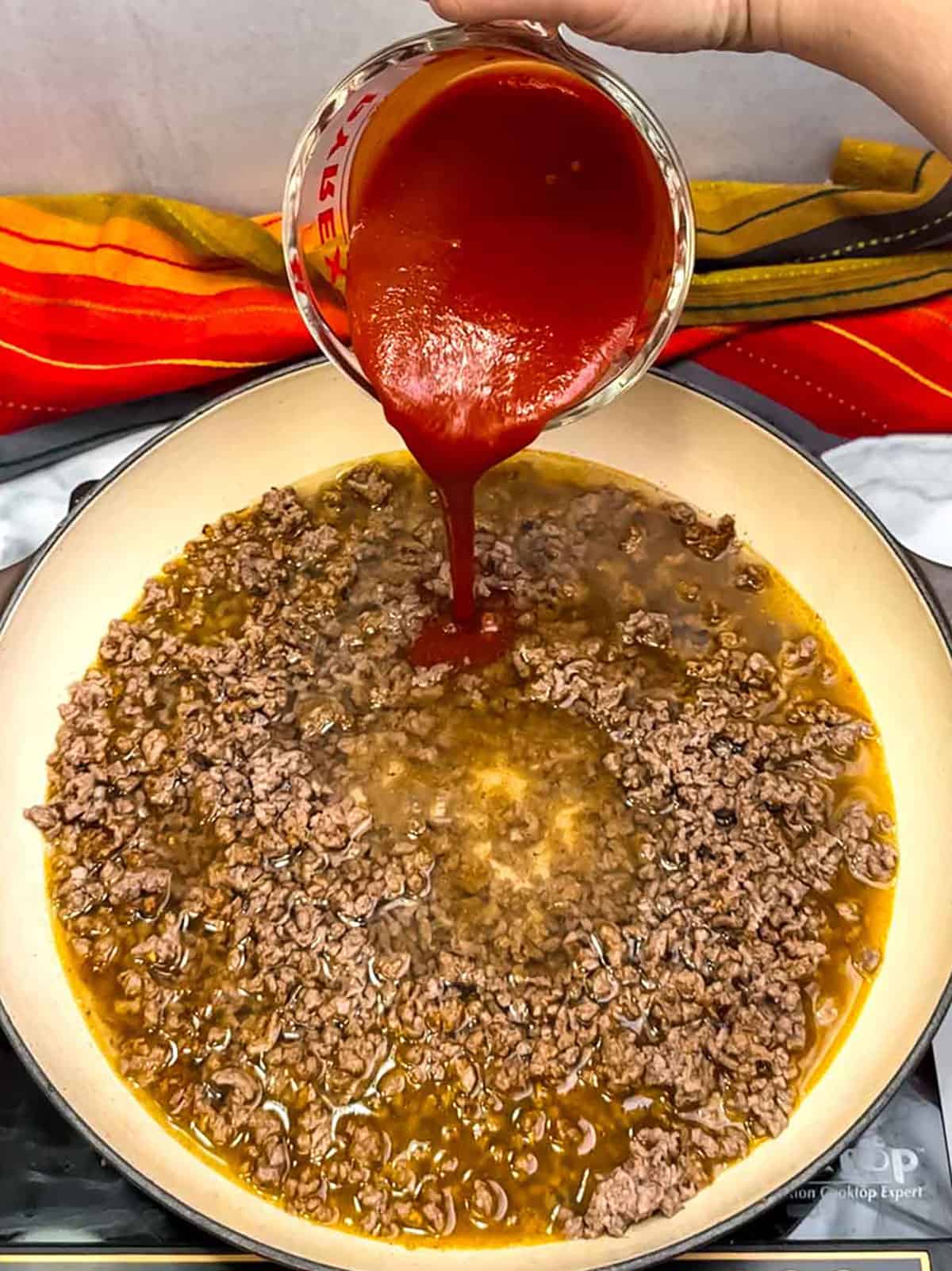 adding taco seasoning