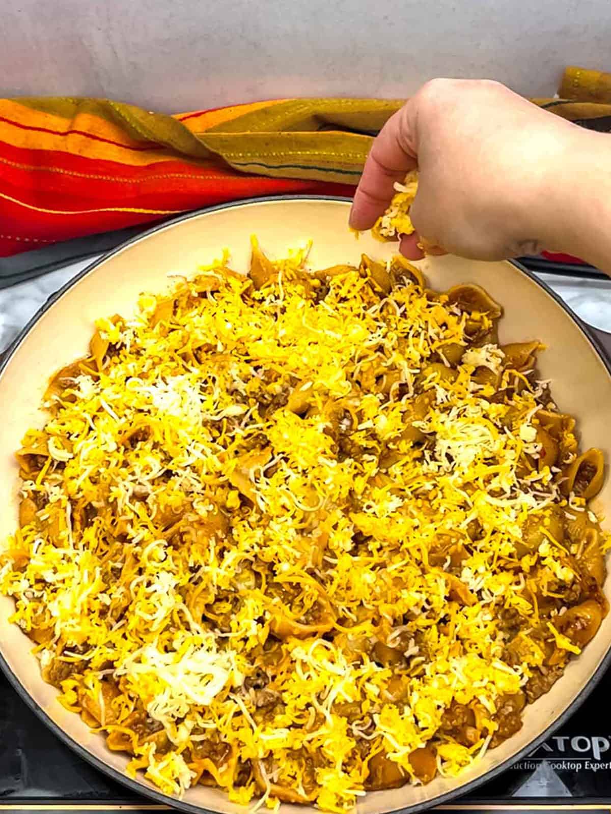 topping with more cheese