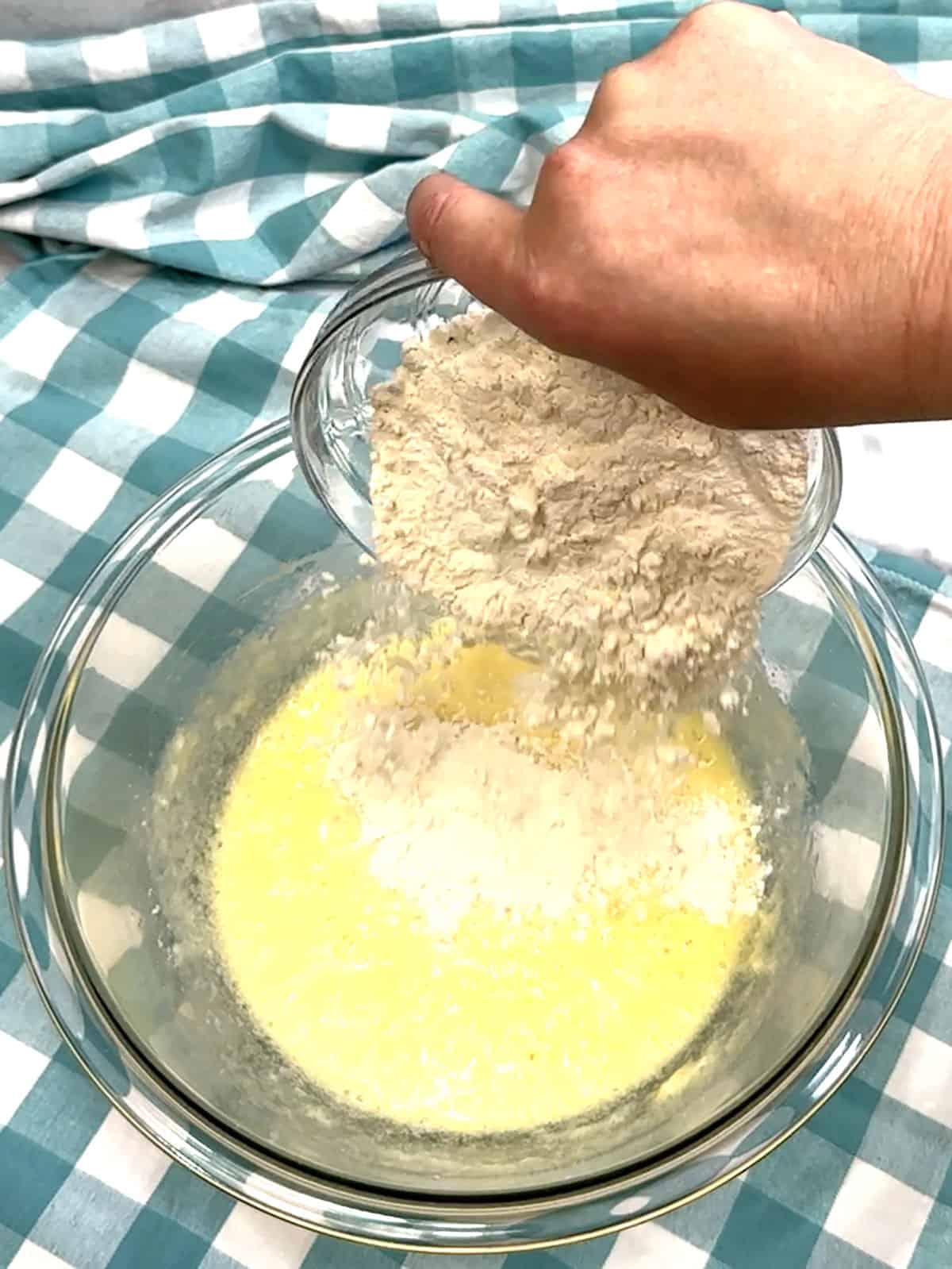 adding dry ingredients to wet