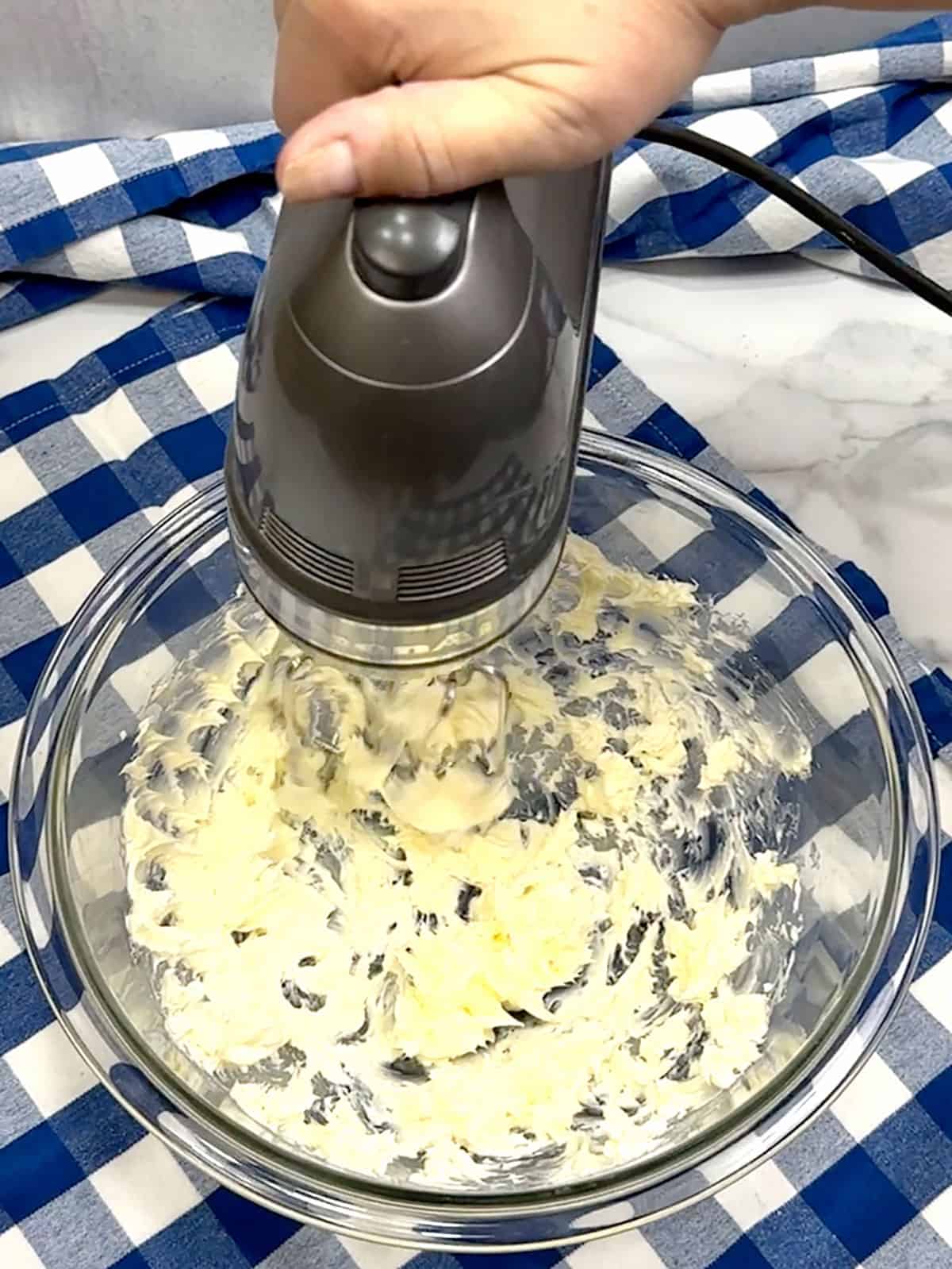beating butter for maple glaze