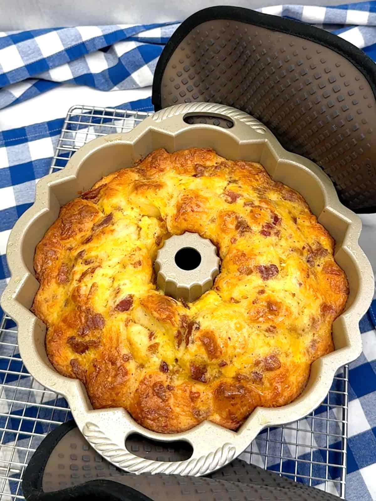 removing bacon egg & cheese bundt cake from oven