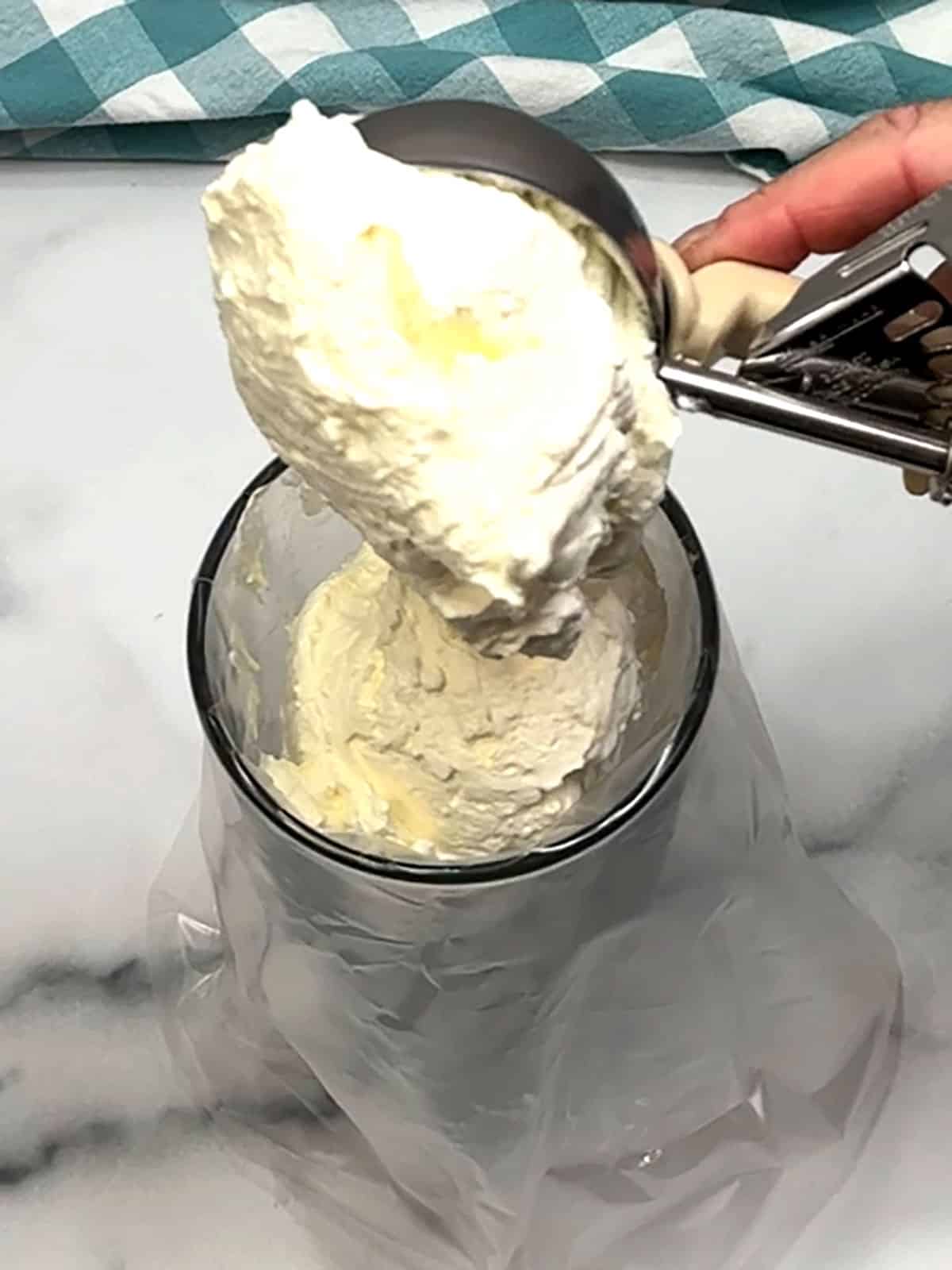 placing whipped cream in piping bag