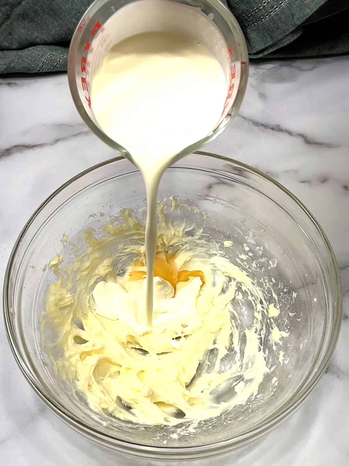 adding cream for frosting