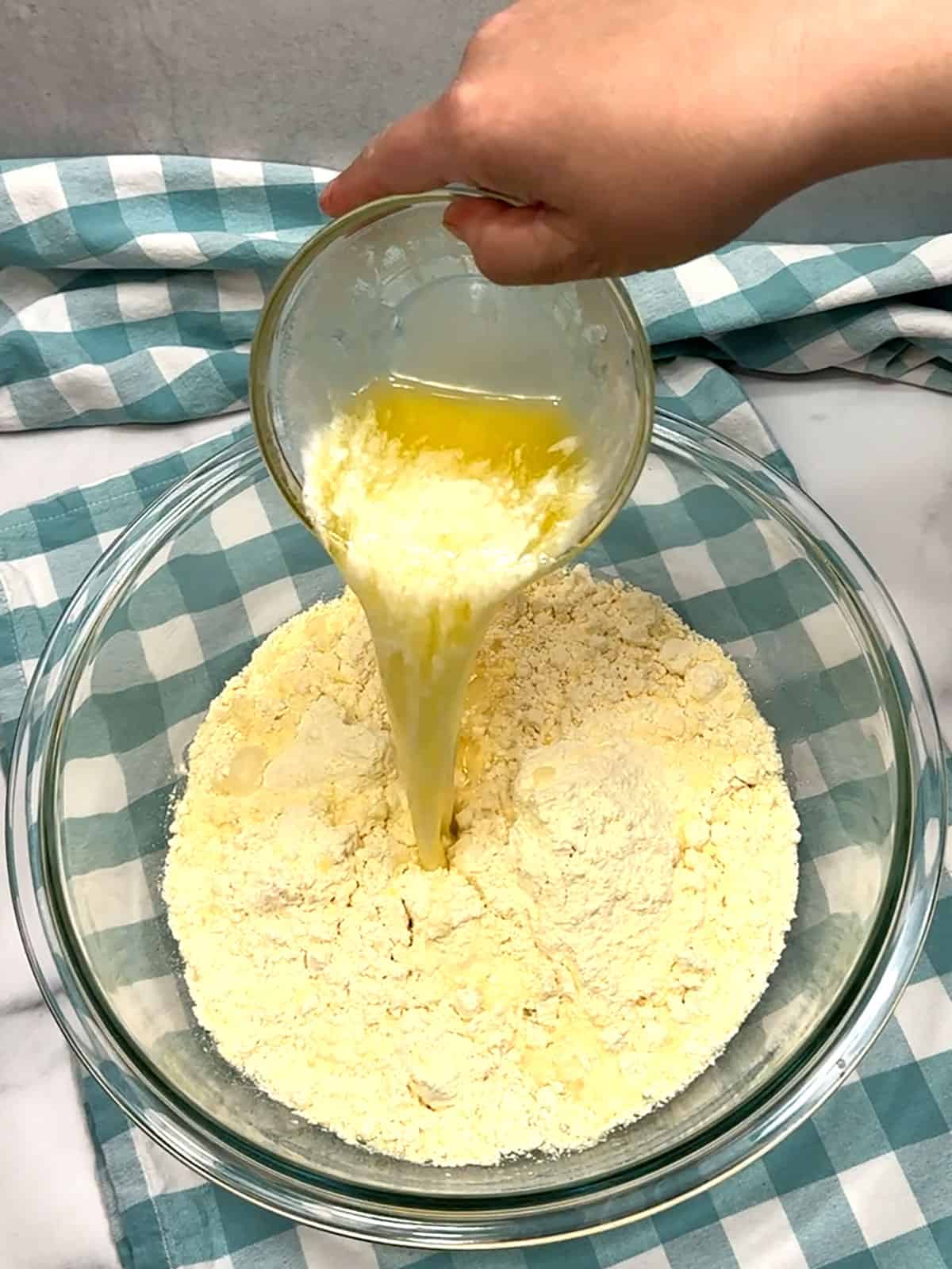 adding melted butter to cake mix