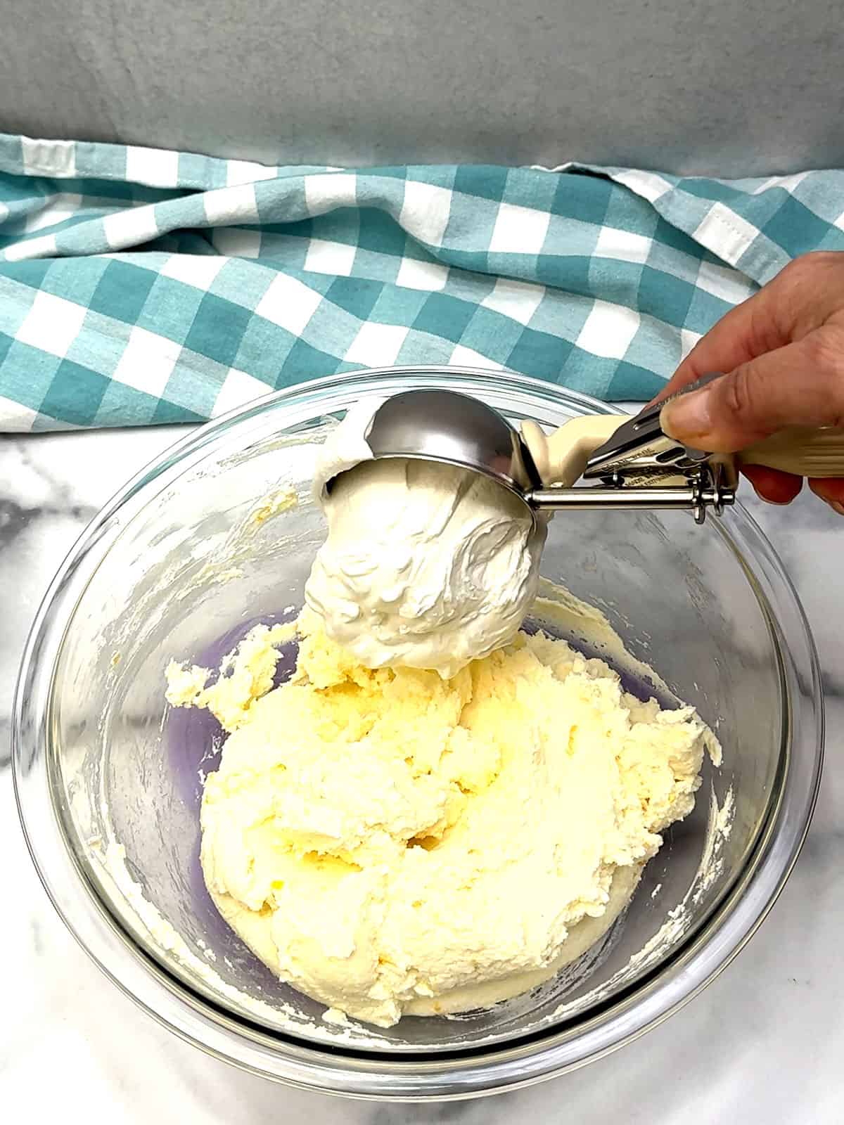 adding whipped cream to mascarpone mixture