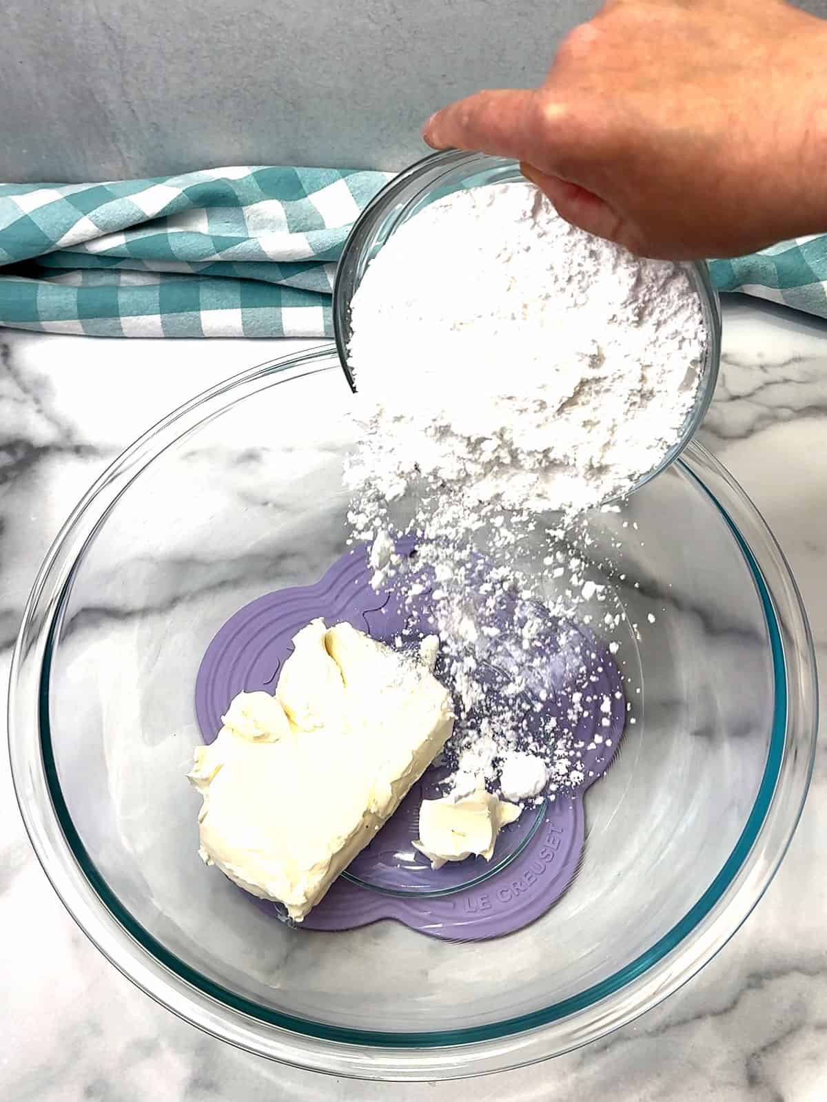 adding powdered sugar to cream cheese for topping