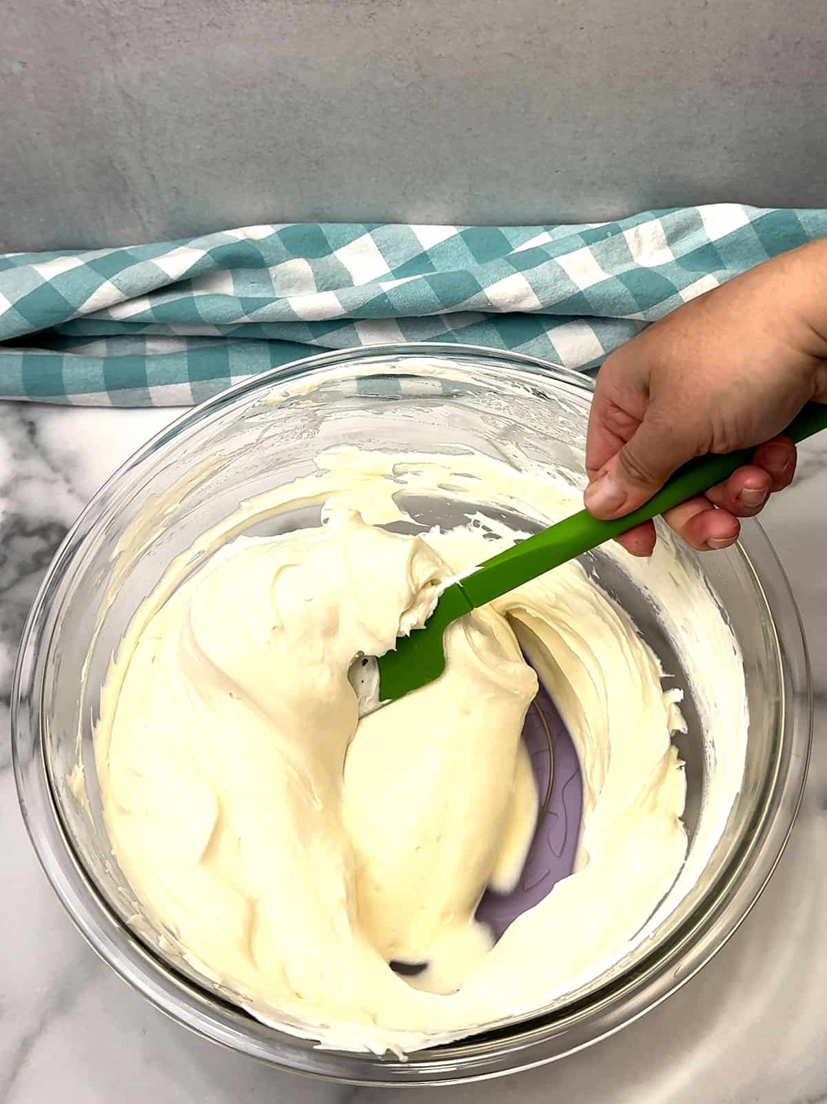 folding whipped cream into filling
