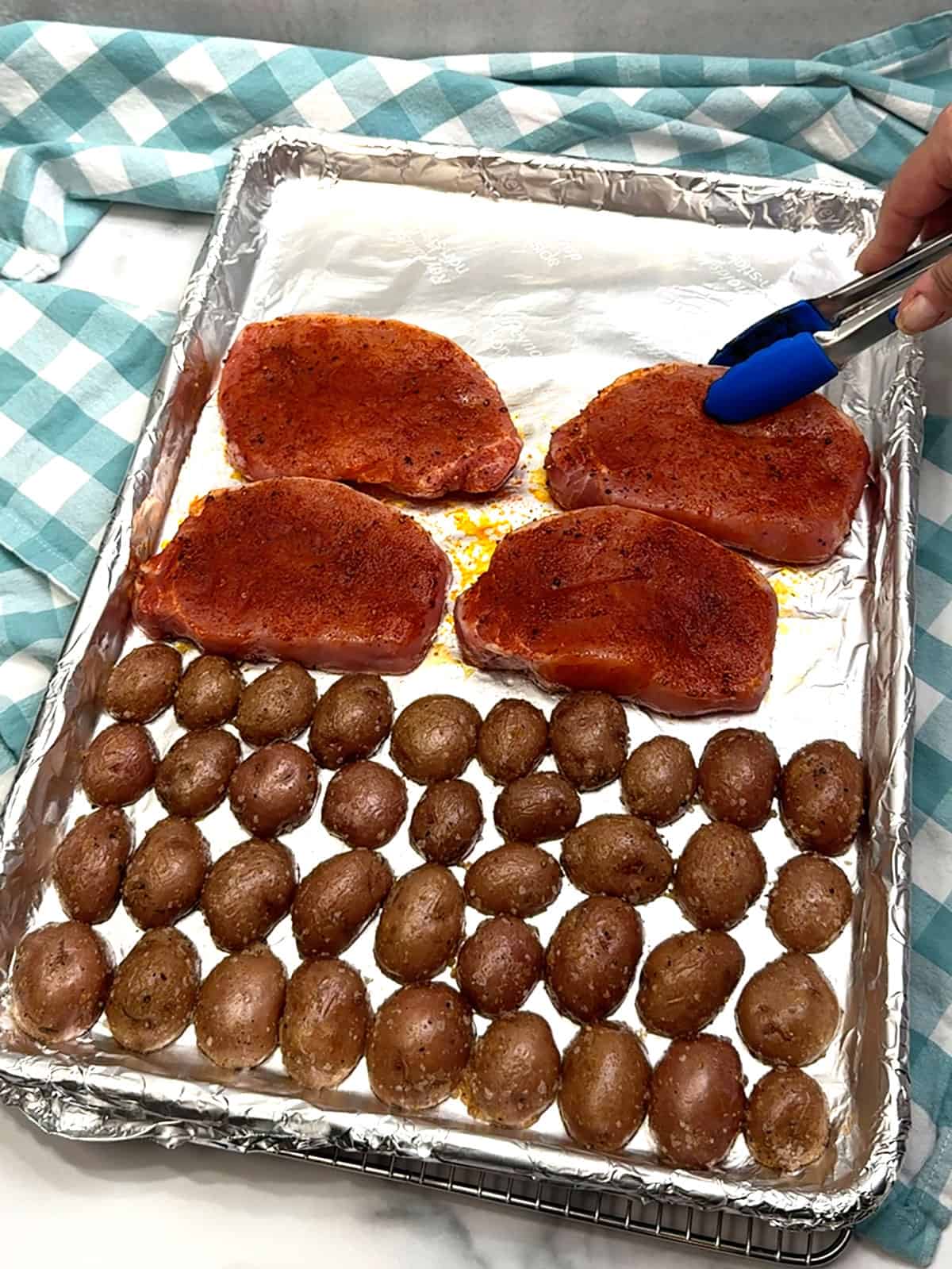 placing pork chops on sheet pan
