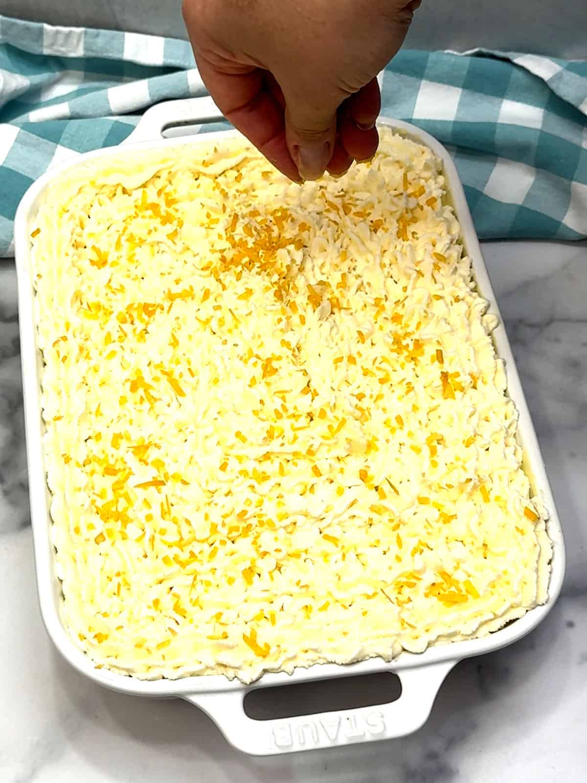 topping tiramisu with lemon zest