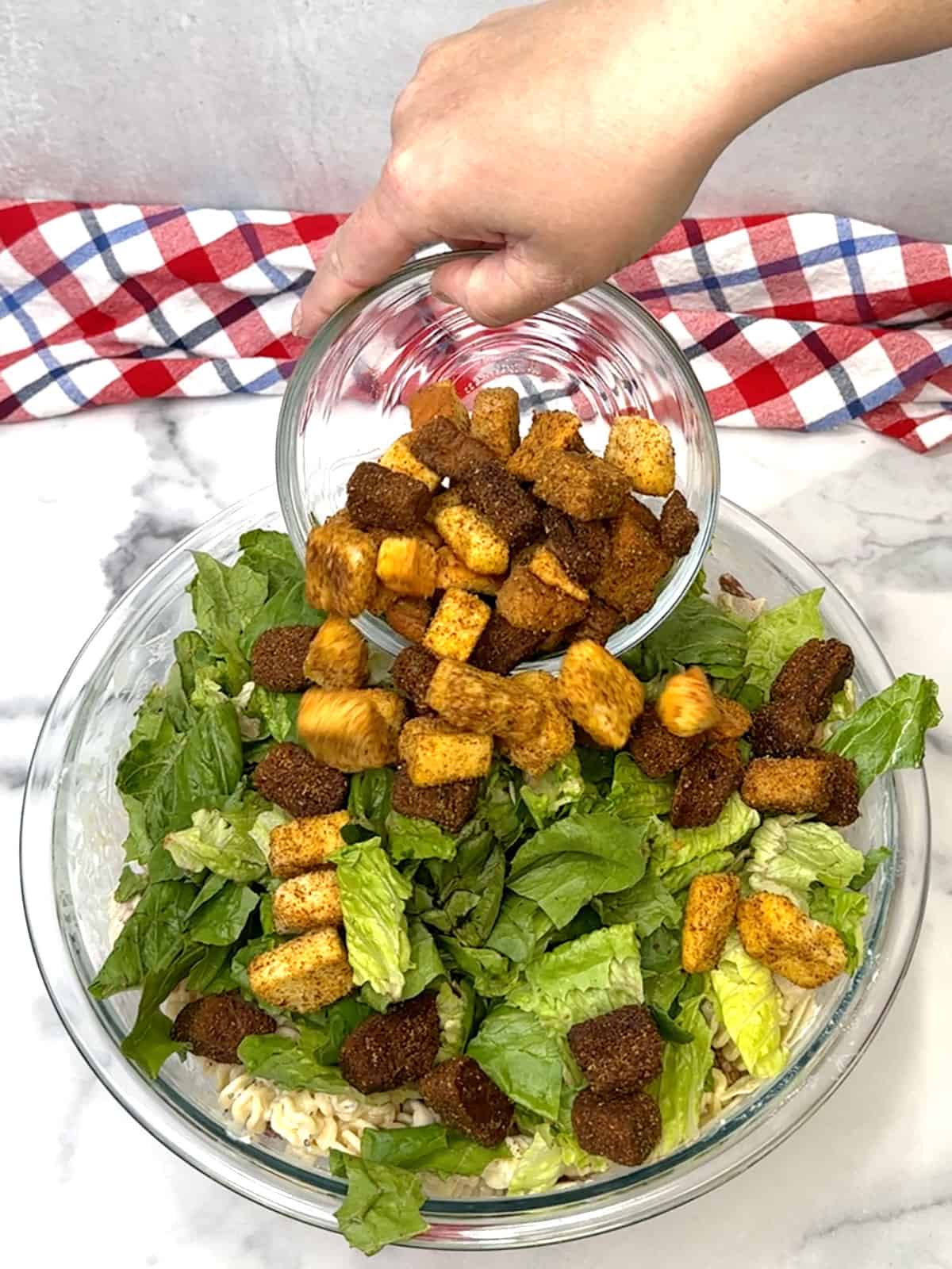 adding romaine and croutons