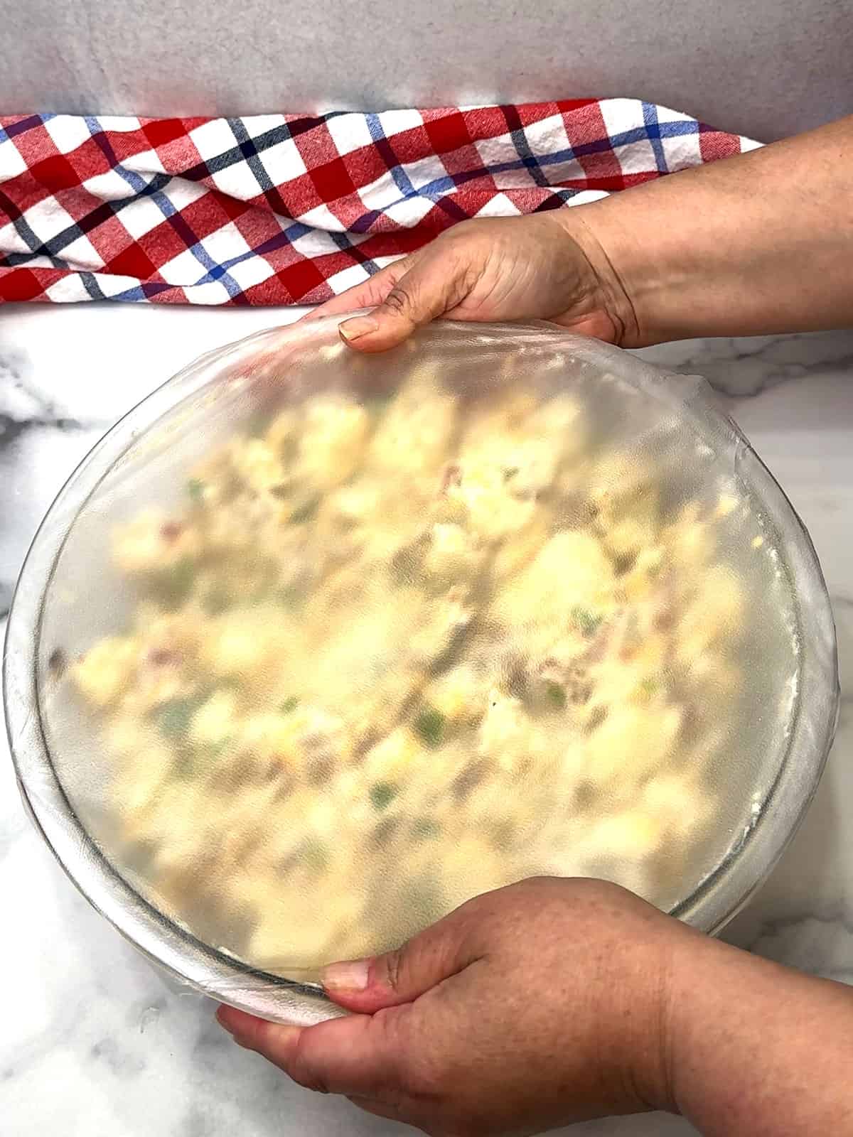 covering bowl with plastic wrap before refrigerating