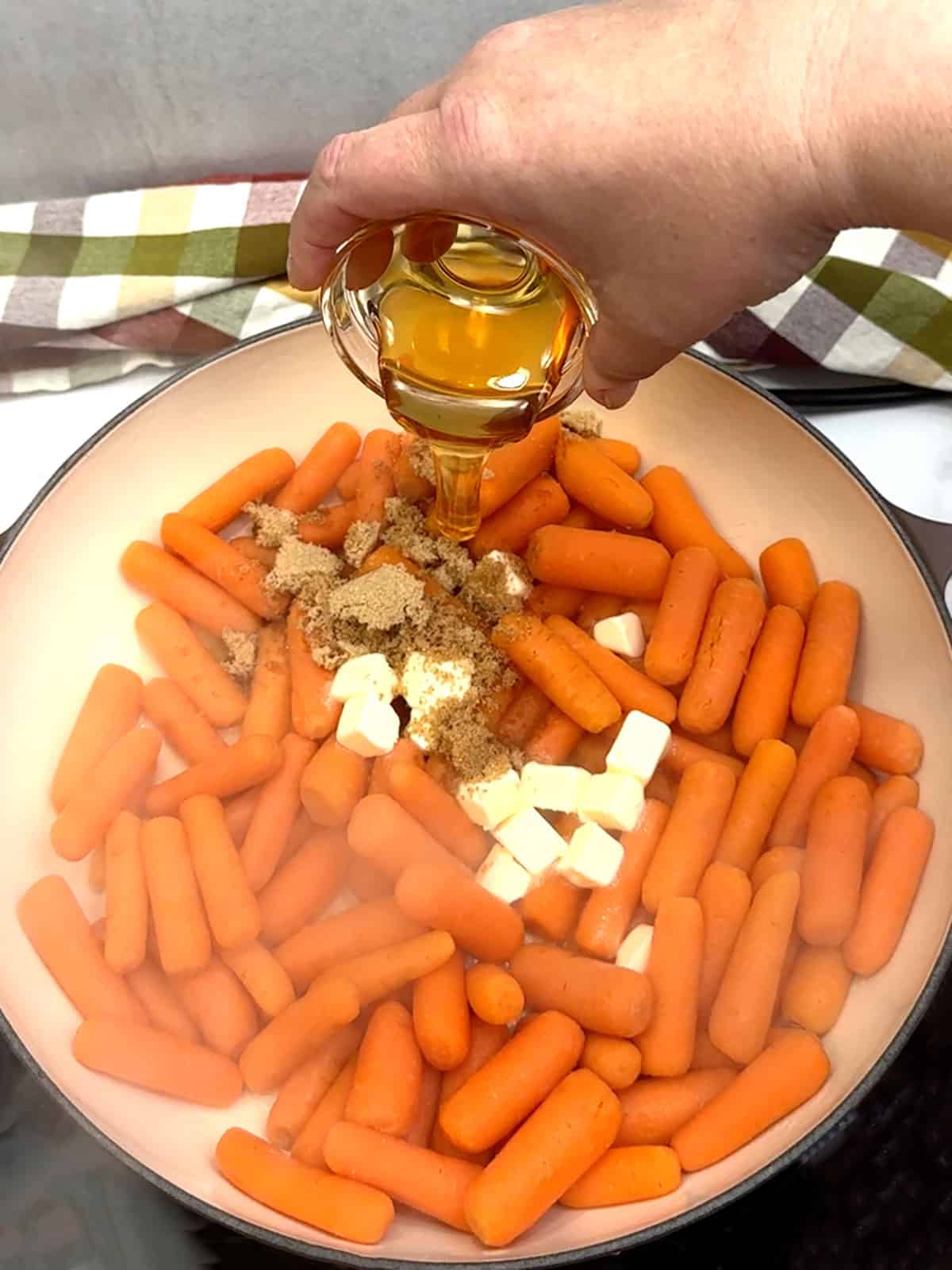 adding brown sugar, honey, and butter to carrots