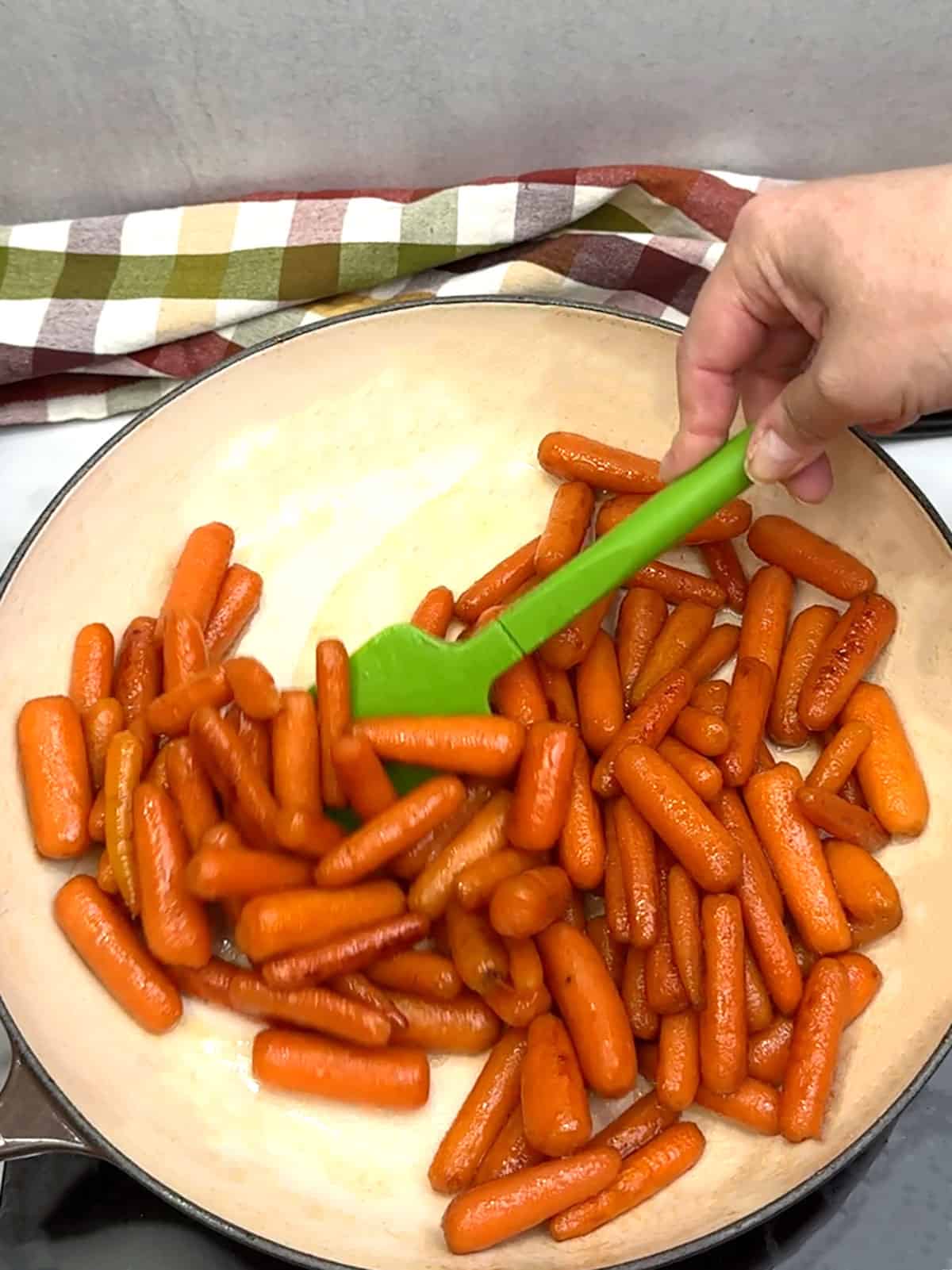 stirring Brown Sugar and Honey Glazed Baby Carrots