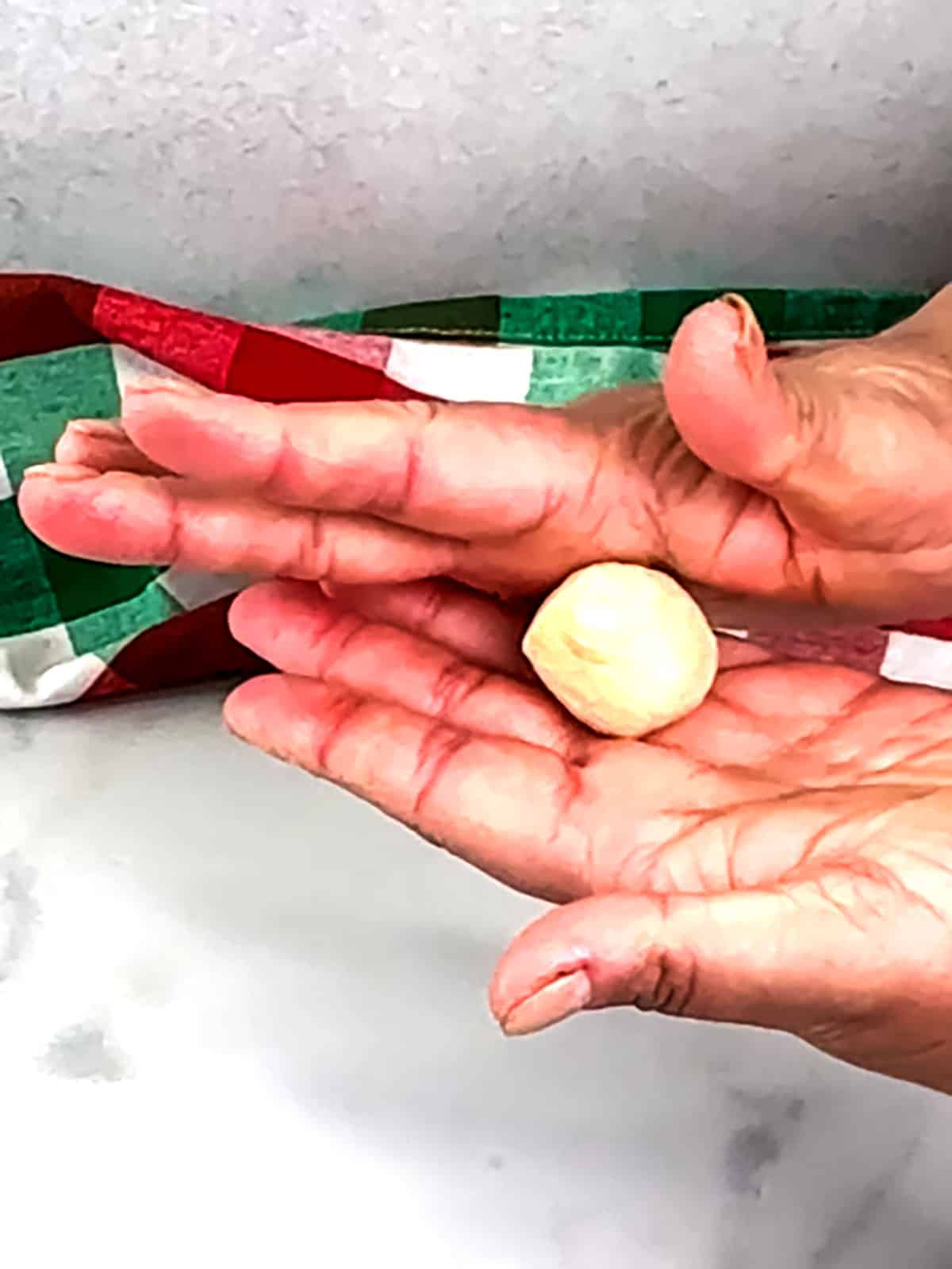 rolling dough ball in your hands 