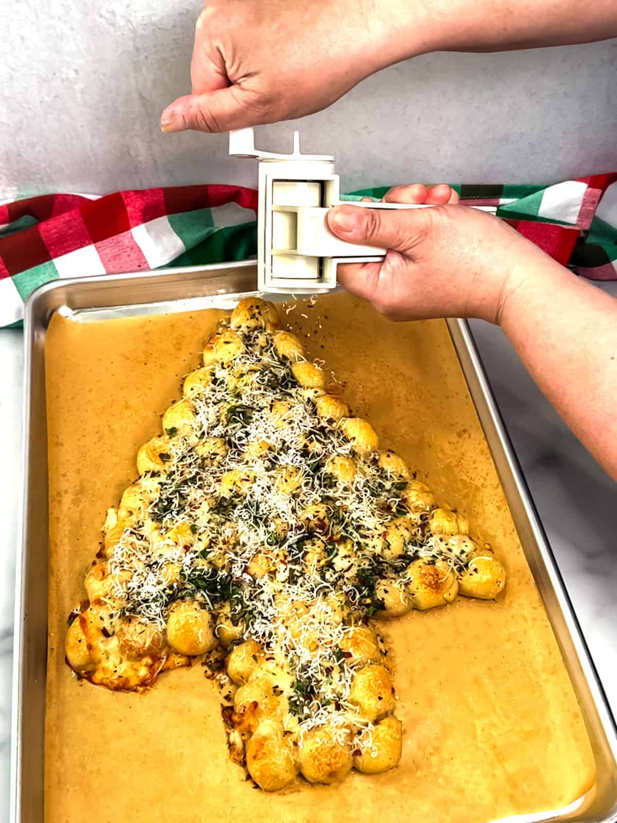 grating parmesan cheese on top