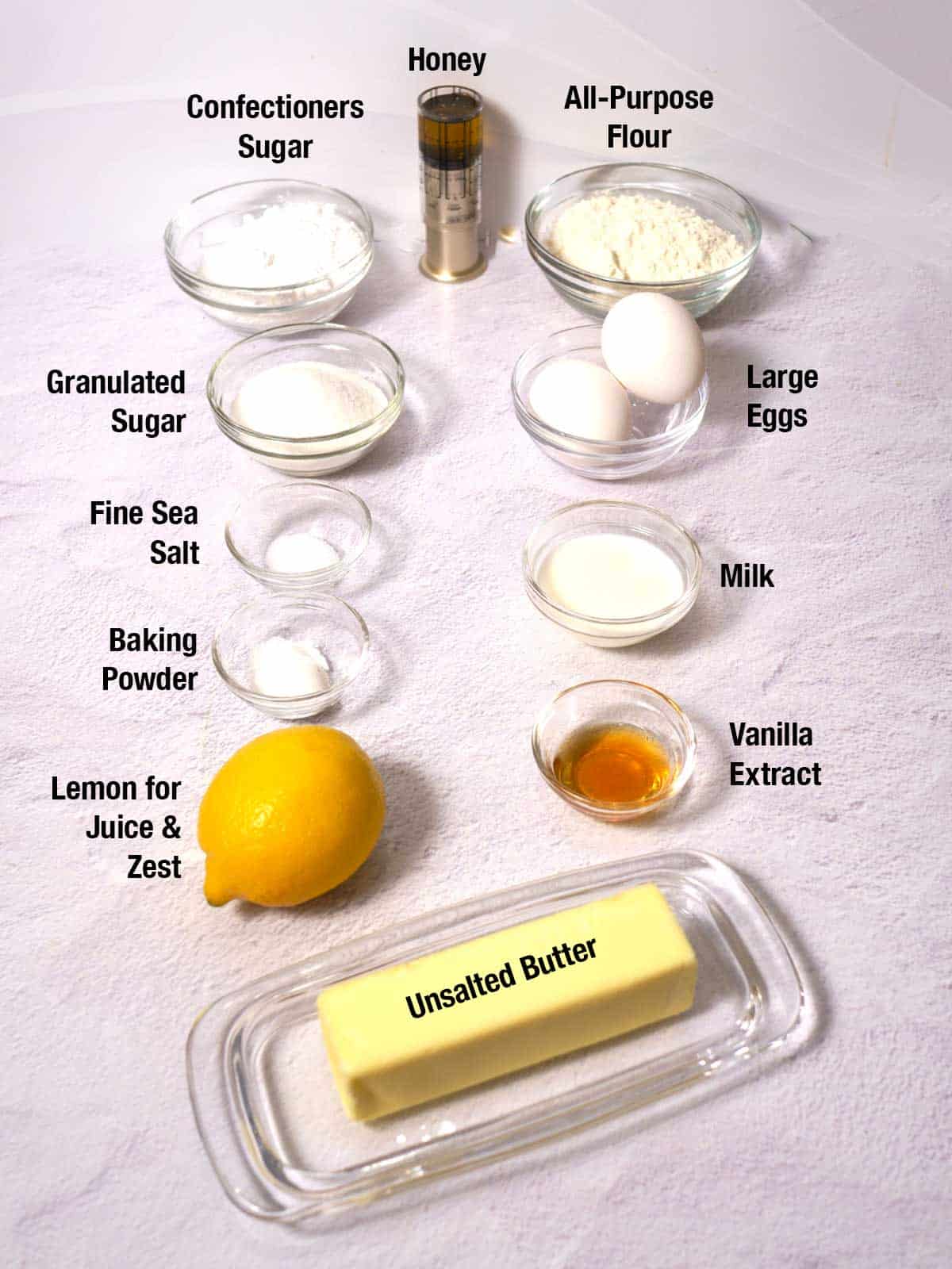 Ingredients for madeleines with lemon glaze.