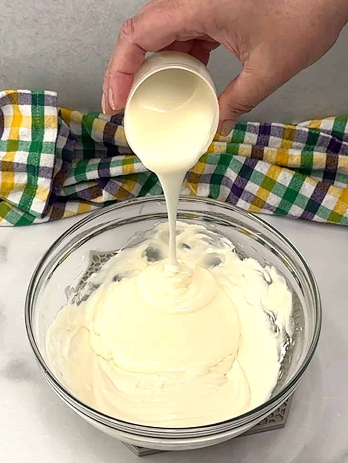 adding canned icing to prepared icing