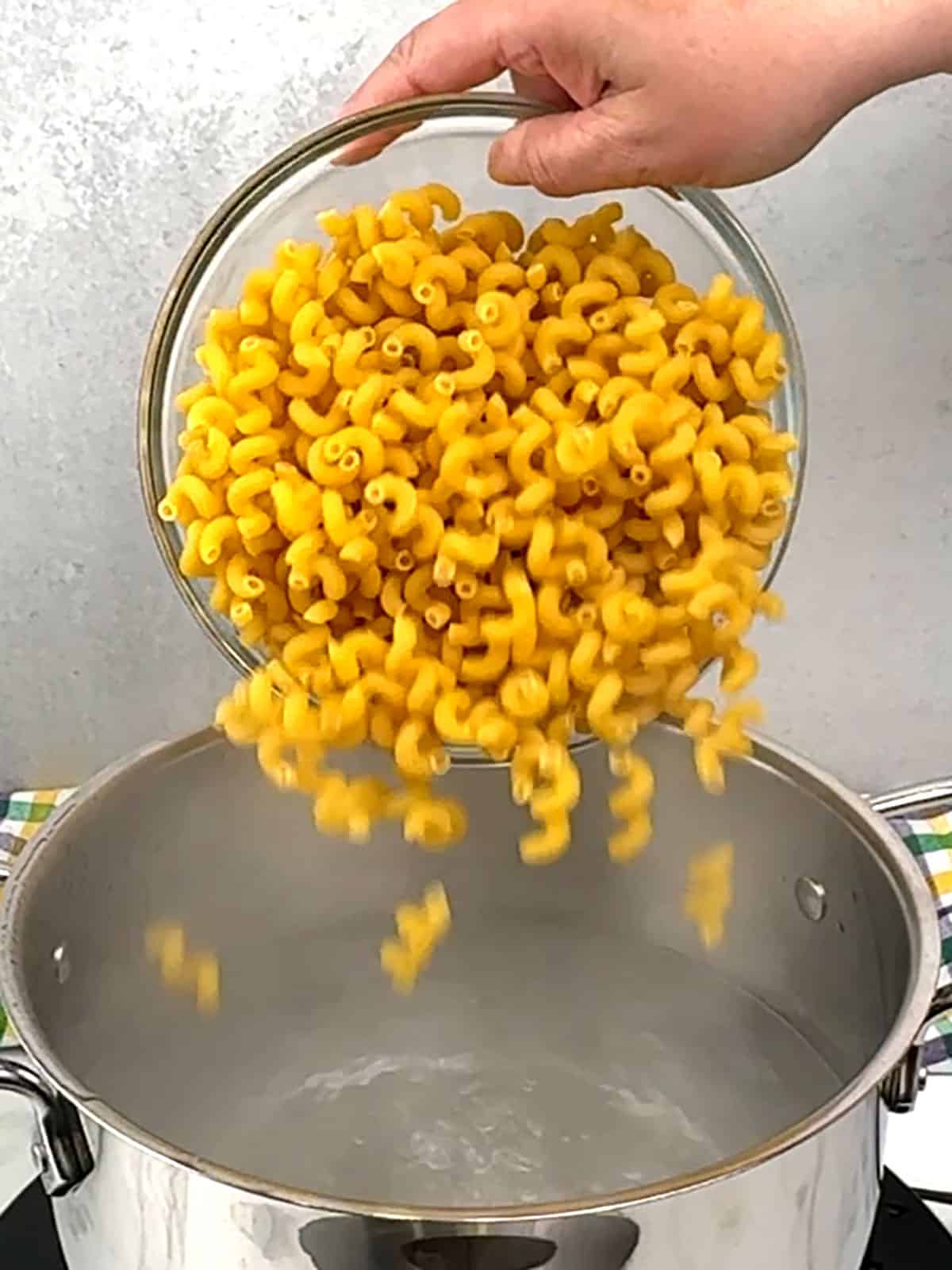 adding pasta to water