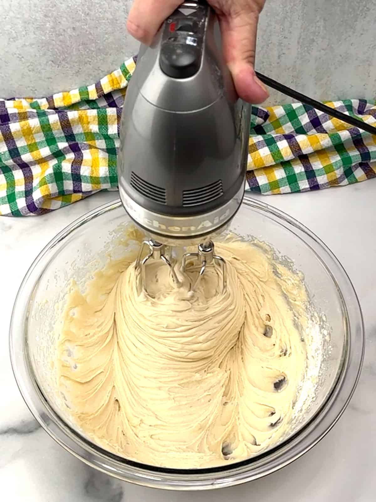 beating cinnamon roll batter