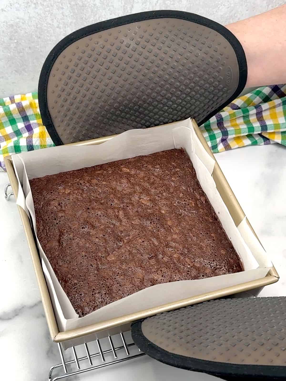 removing brownies from the oven