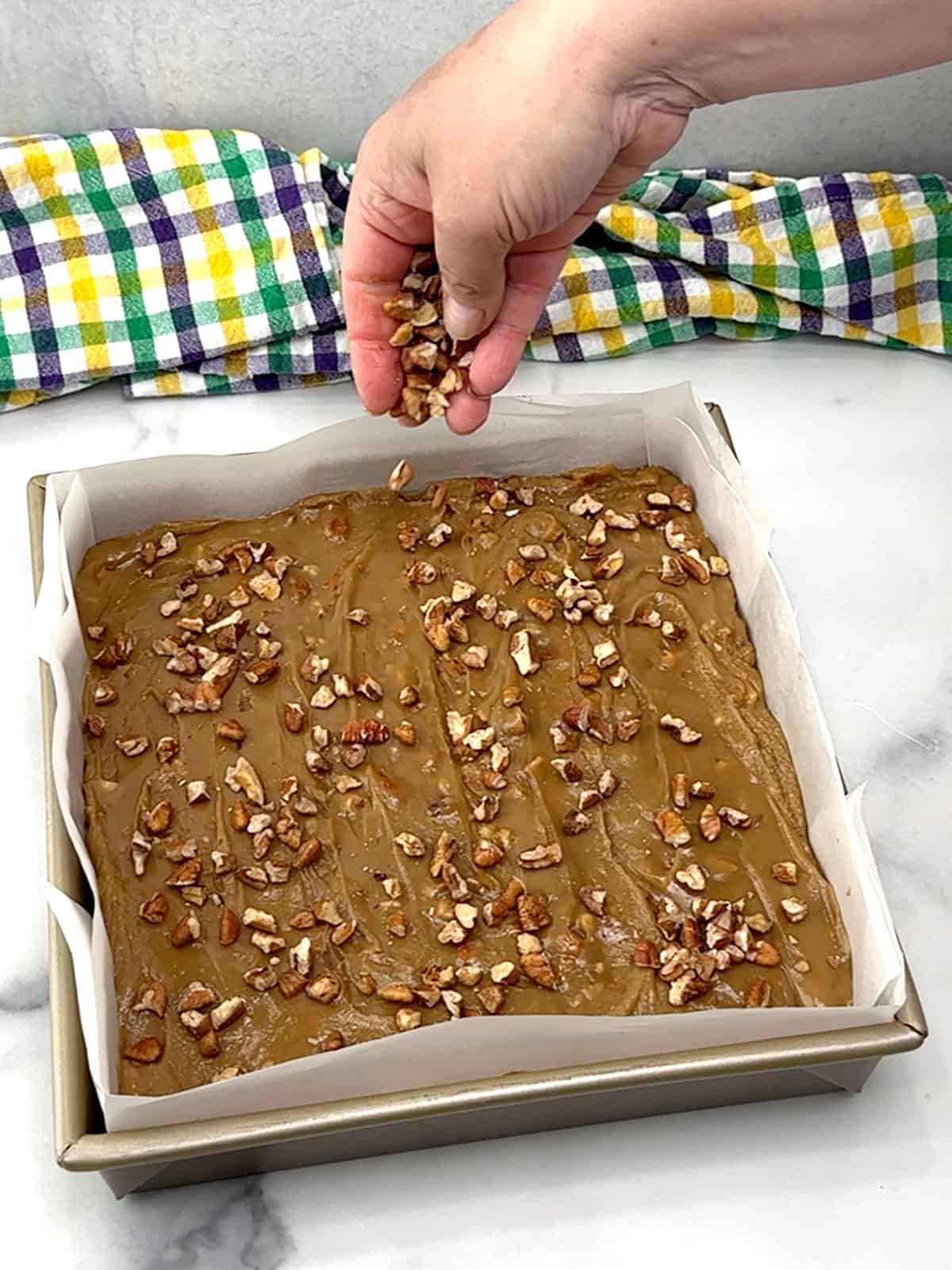 sprinkling pecan pieces on top