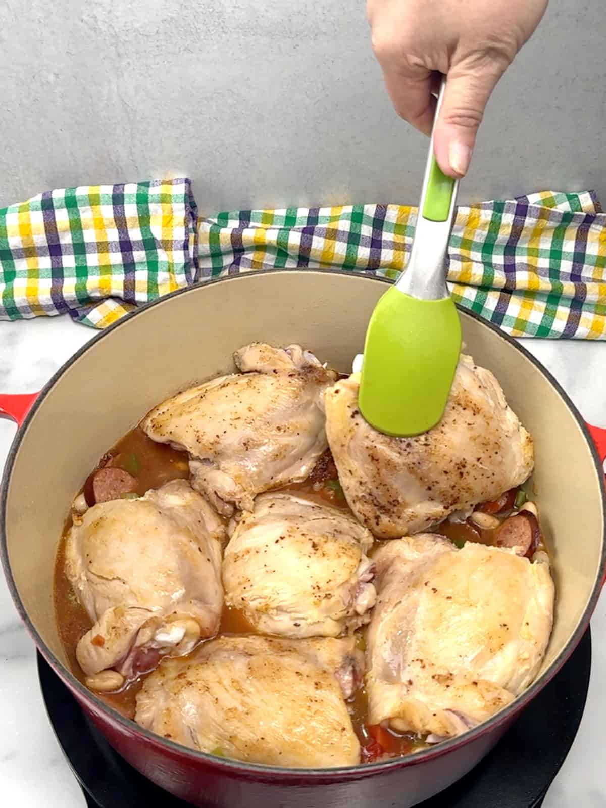 returning chicken thighs to pot