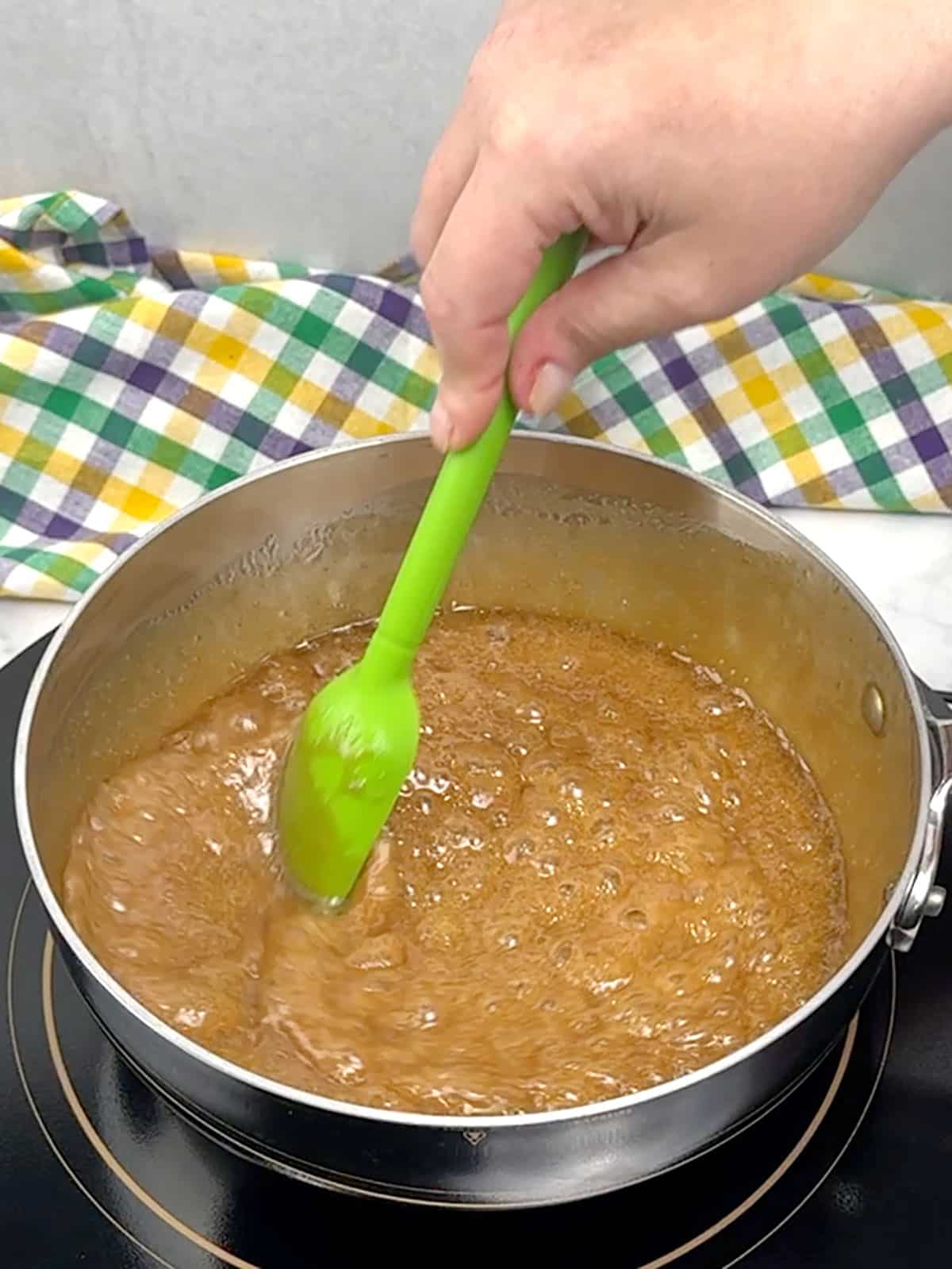 stirring boiling praline mixture