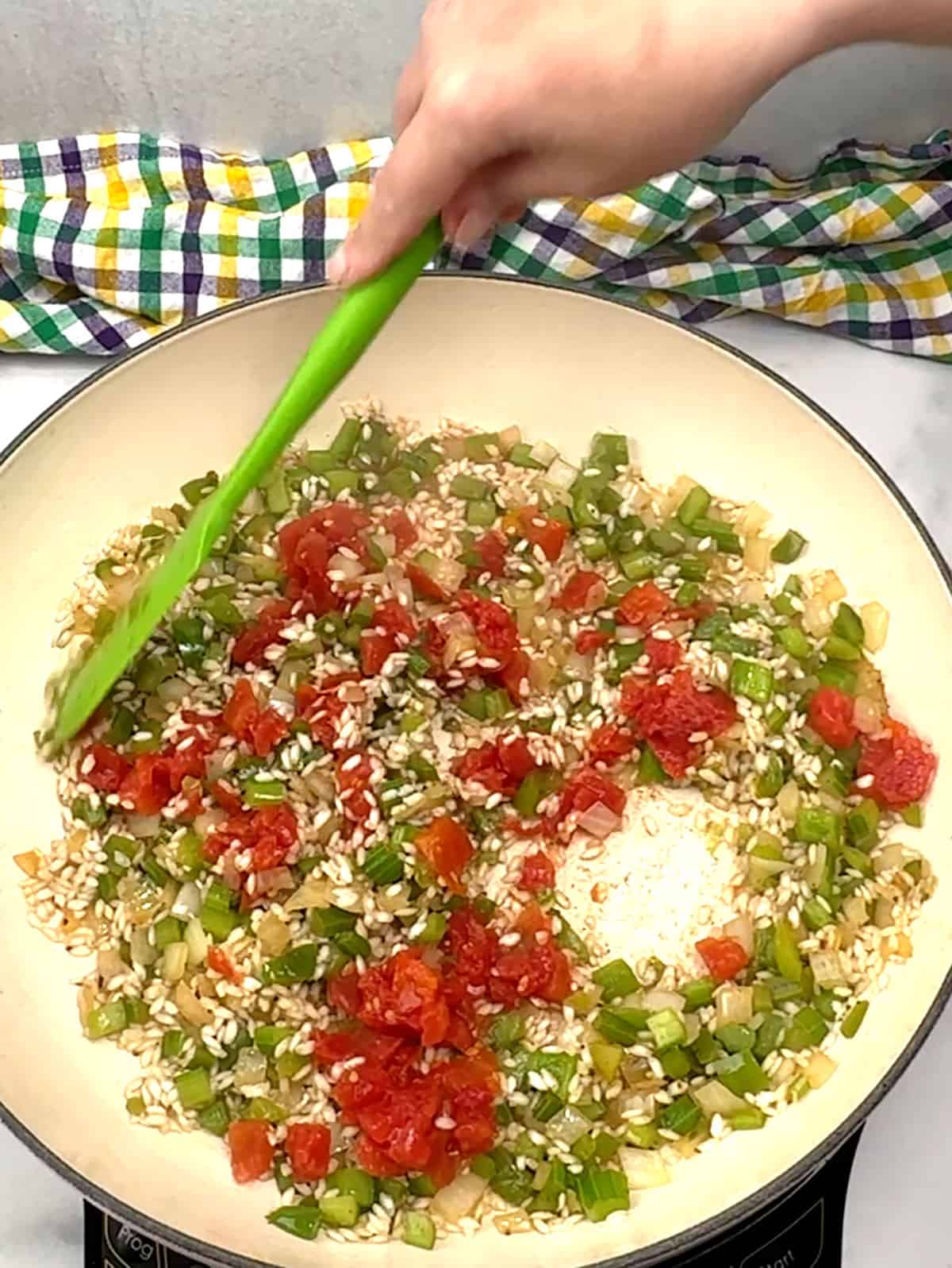 stirring in diced tomatoes