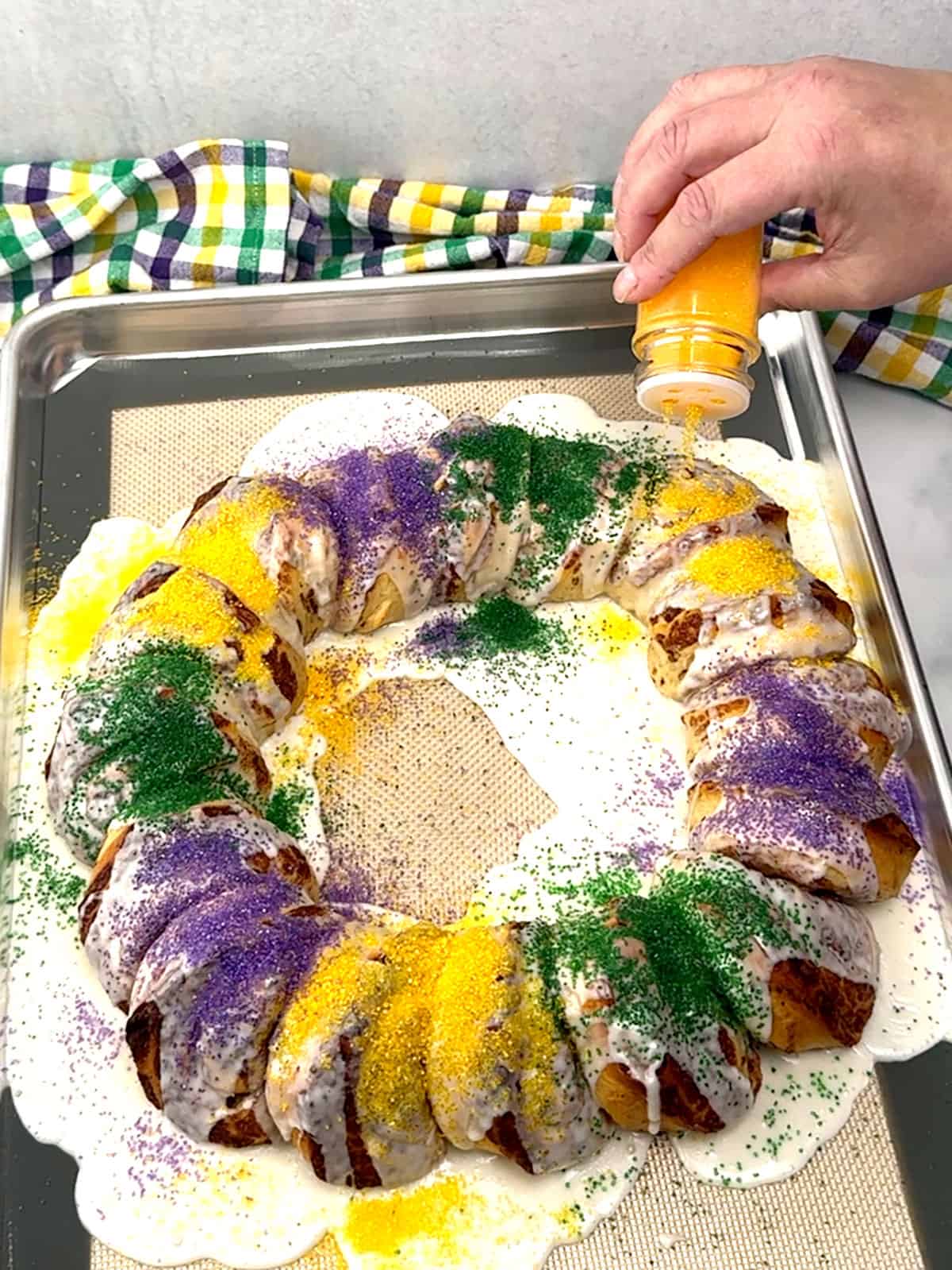 colored sugar on top of king cake