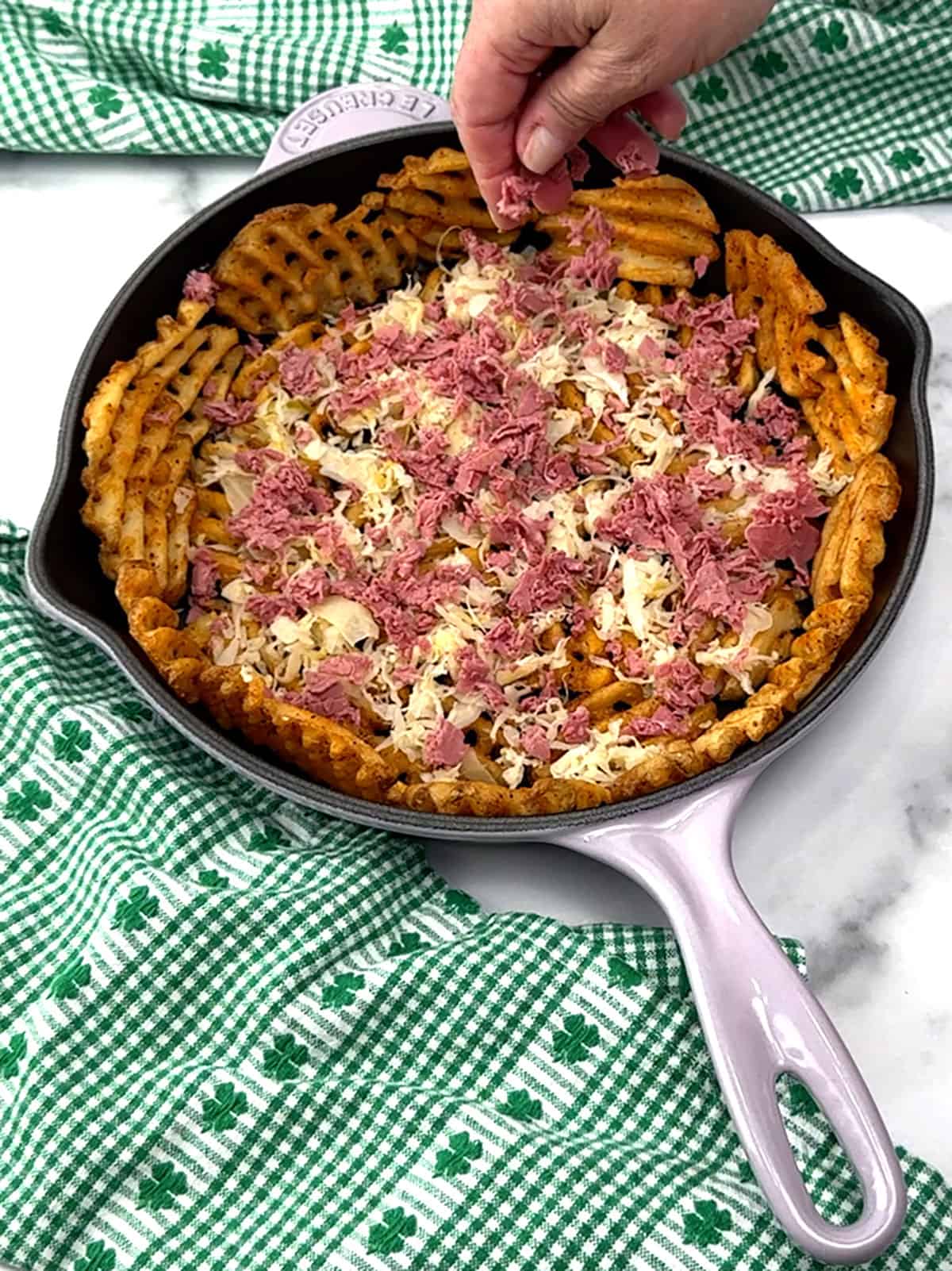 first layer of corned beef over sauerkraut