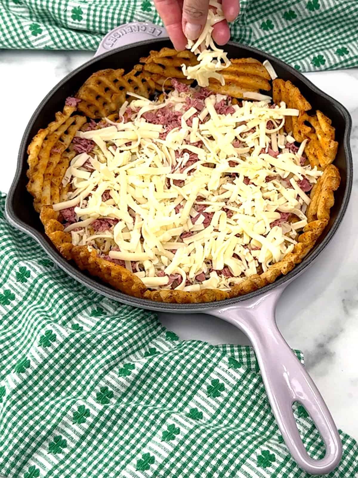 first layer of Swiss cheese over corned beef