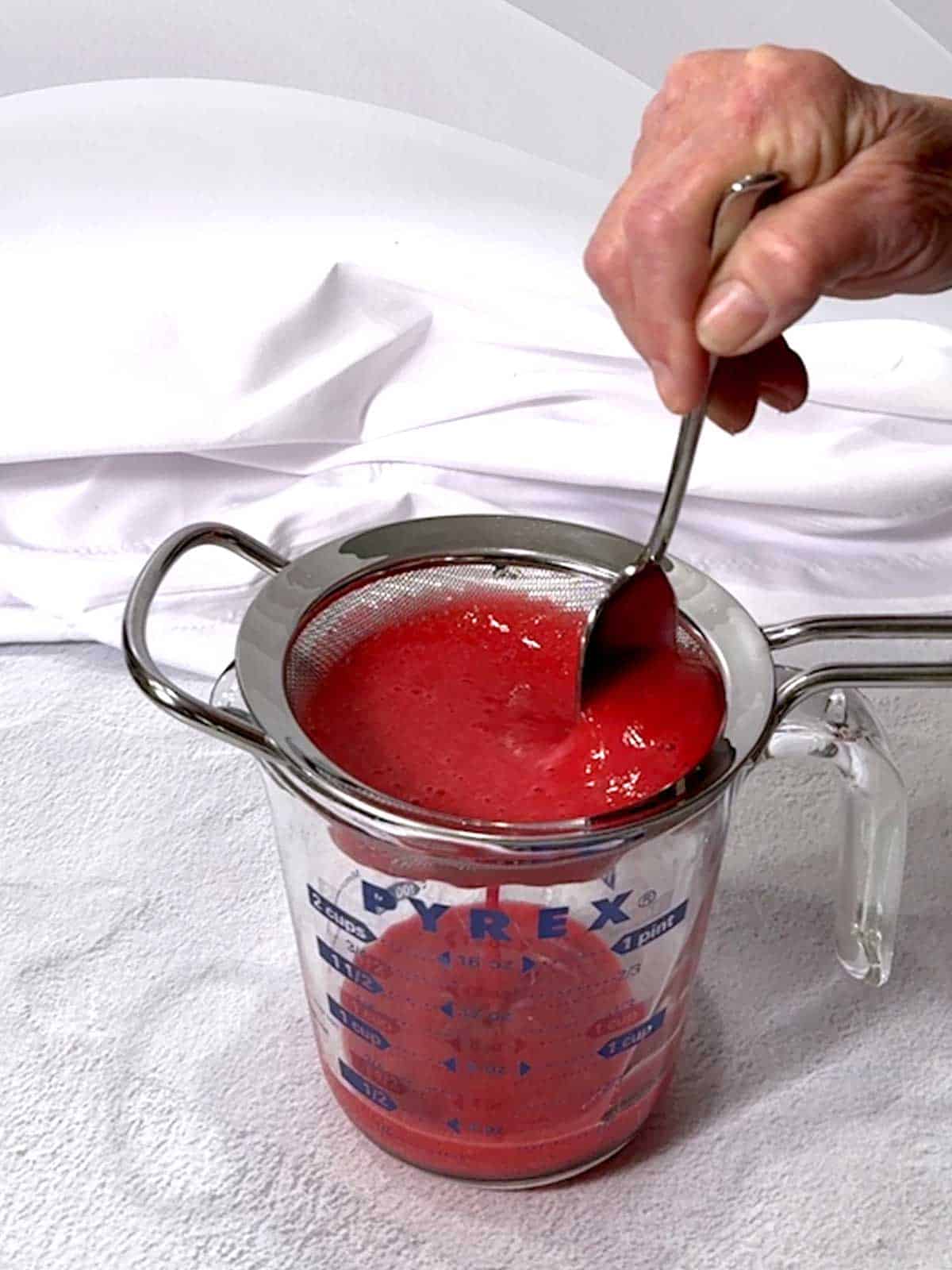 Getting rid of the raspberry seeds.