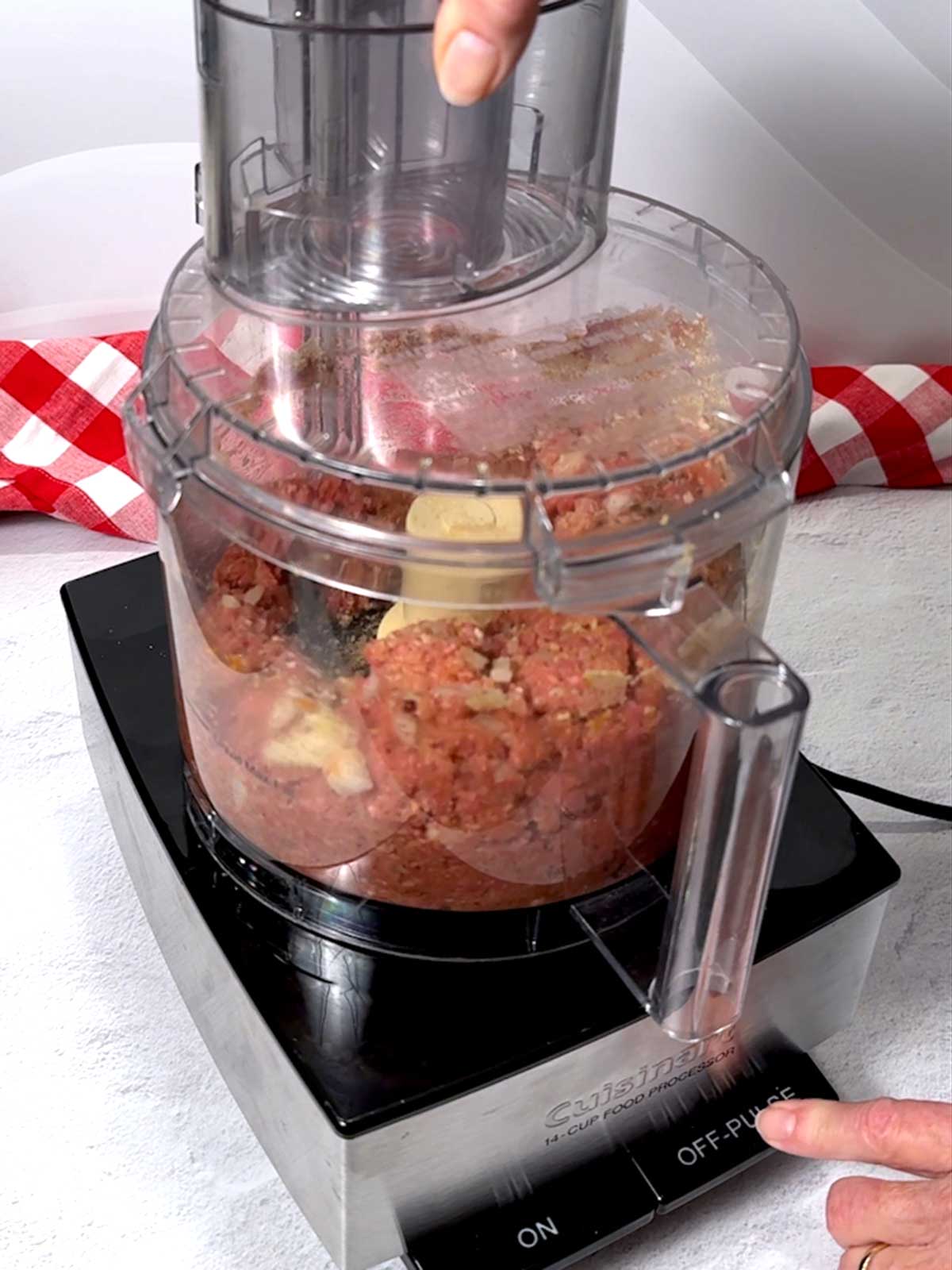 Pulsing the ingredients for the Salisbury steak in the food processor.