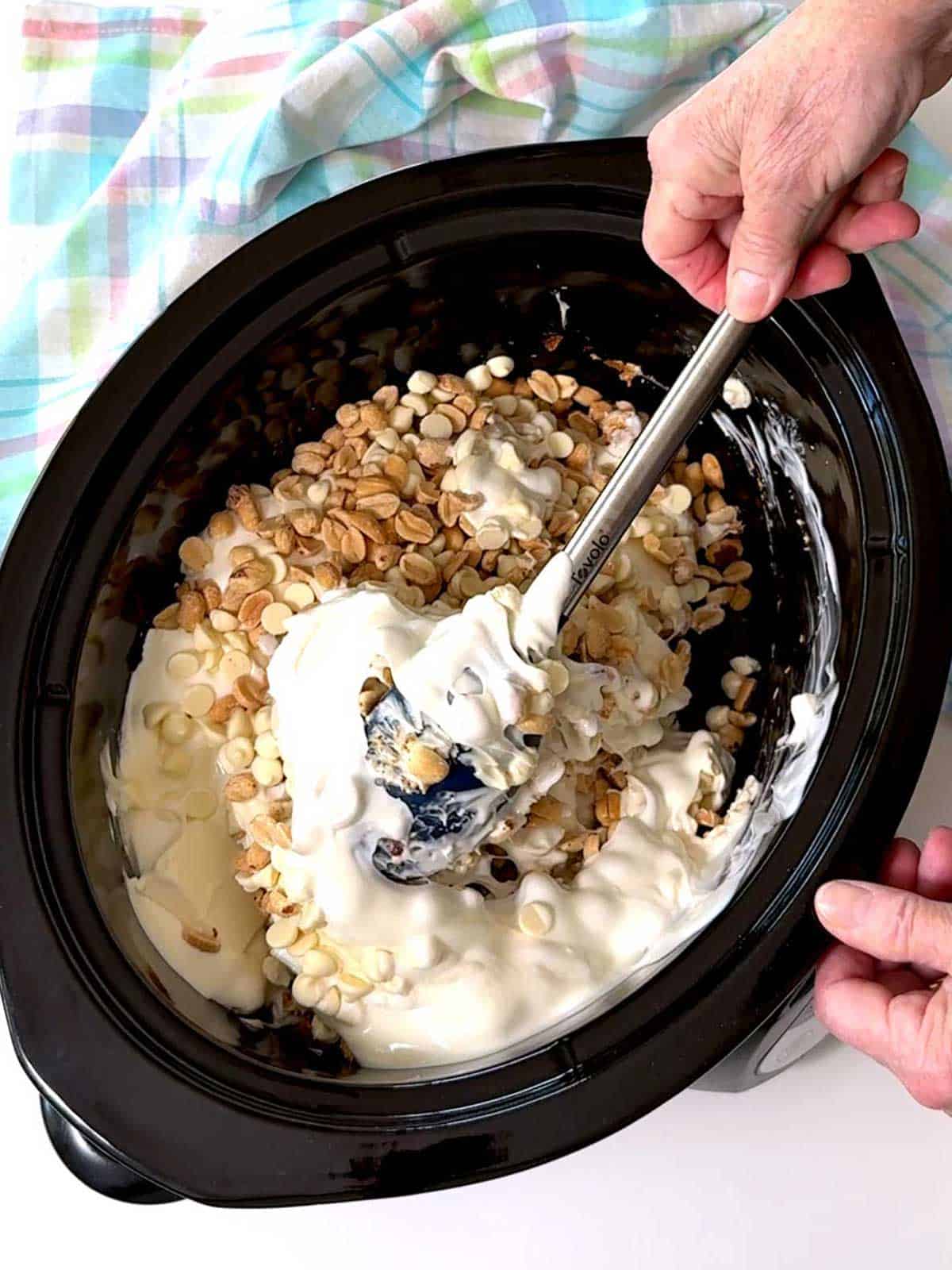 I stirred  the peanuts together with the melted white chips and the almond bark.