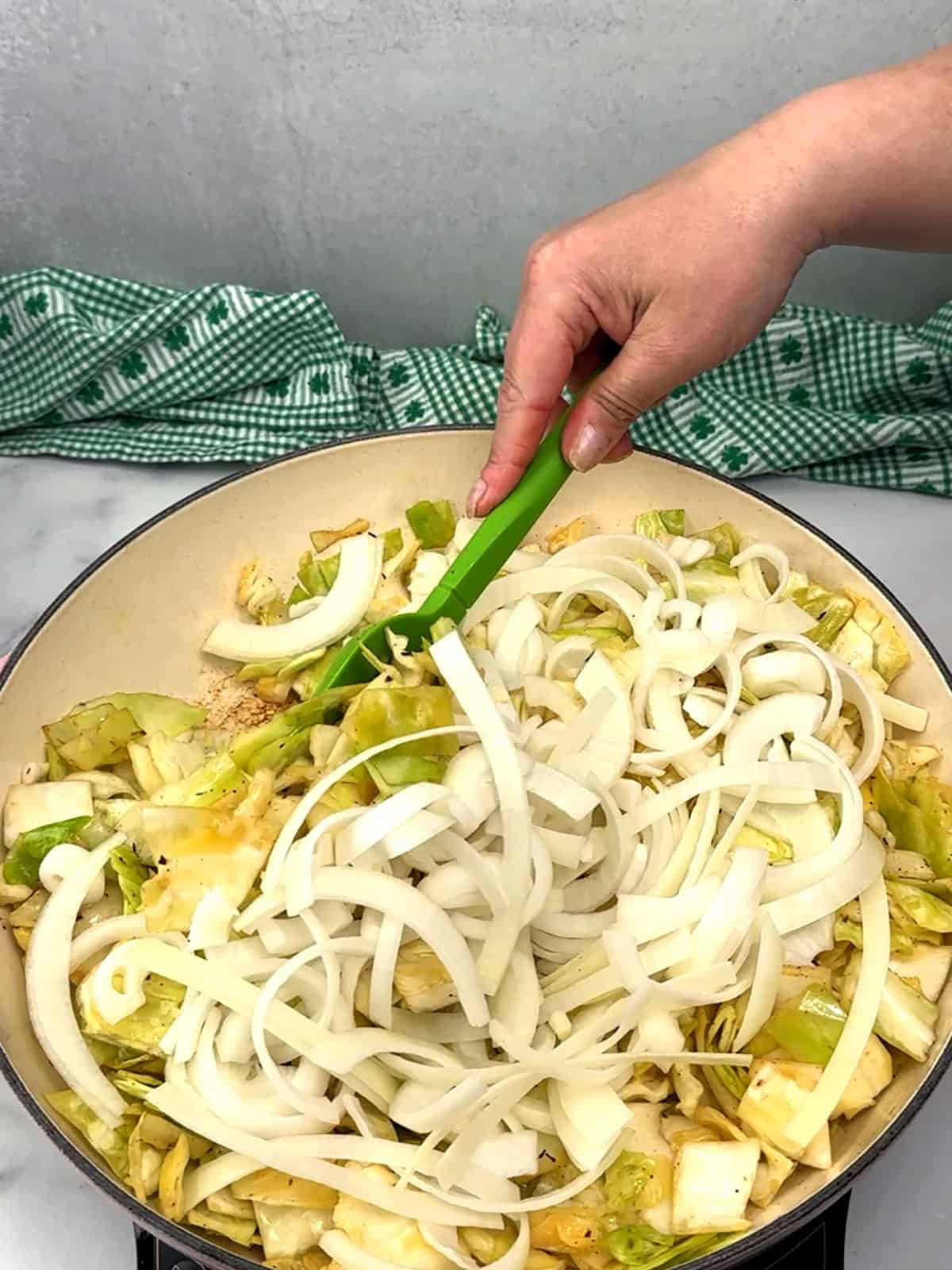 adding sliced onions