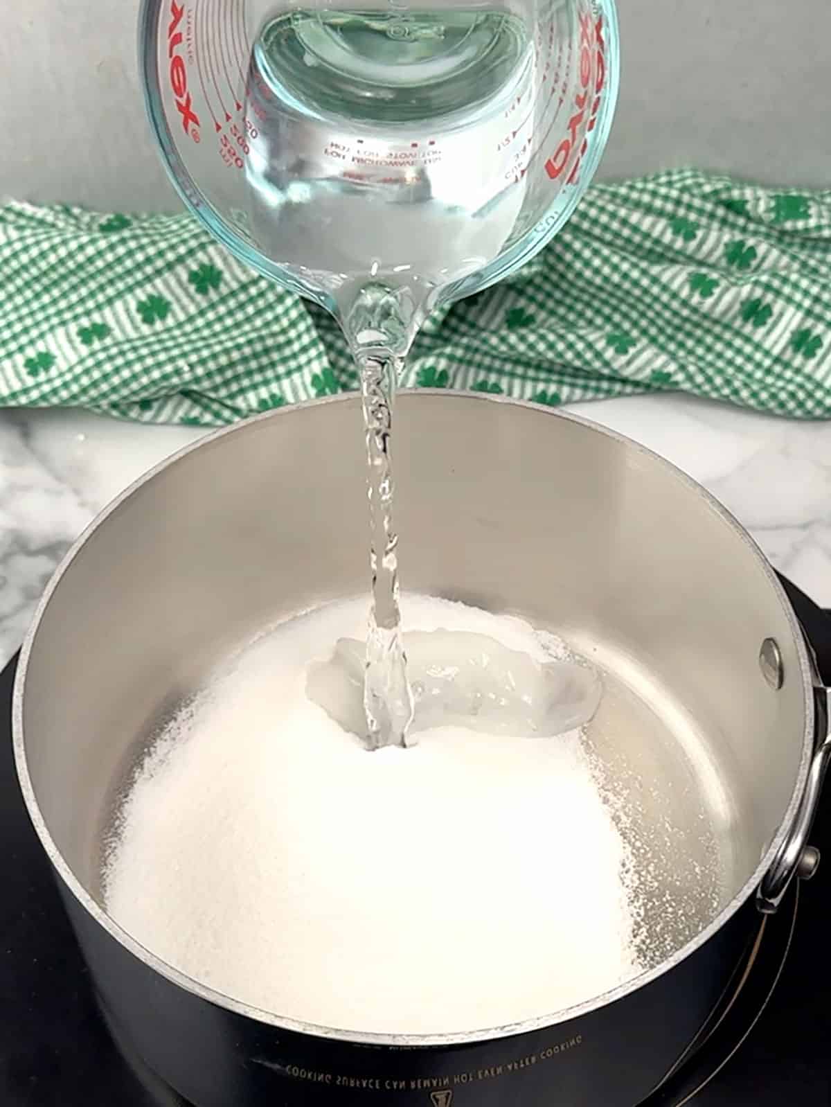 combining water and sugar for glaze