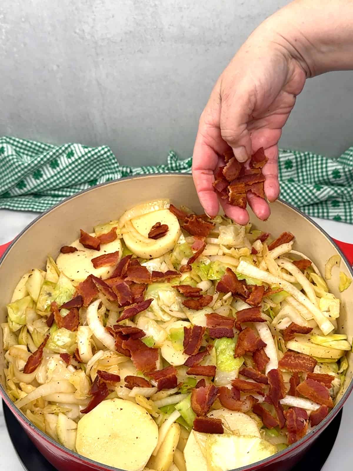sprinkling bacon over the top