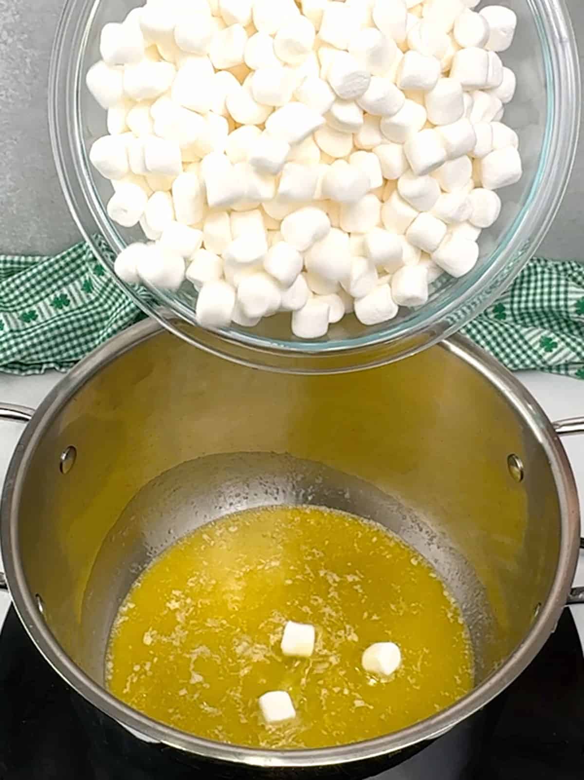 adding marshmallows to malted butter