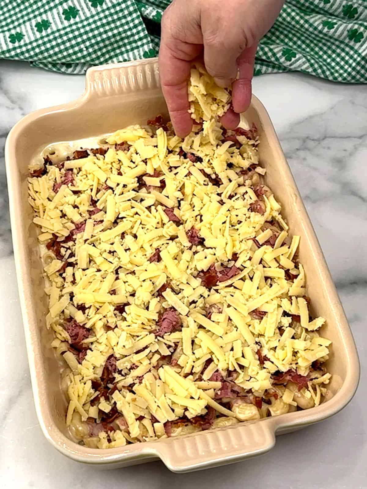 topping with shredded cheese