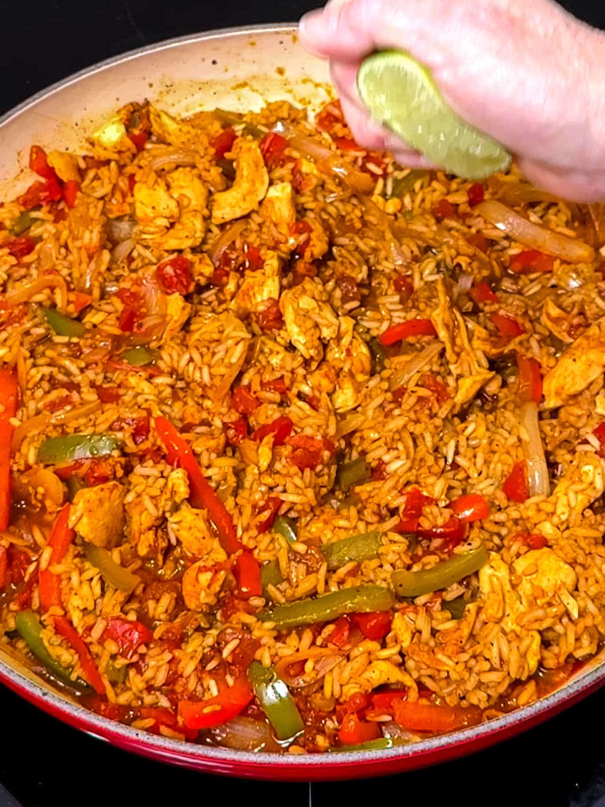 Squeezing lime onto the chicken fajita rice.
