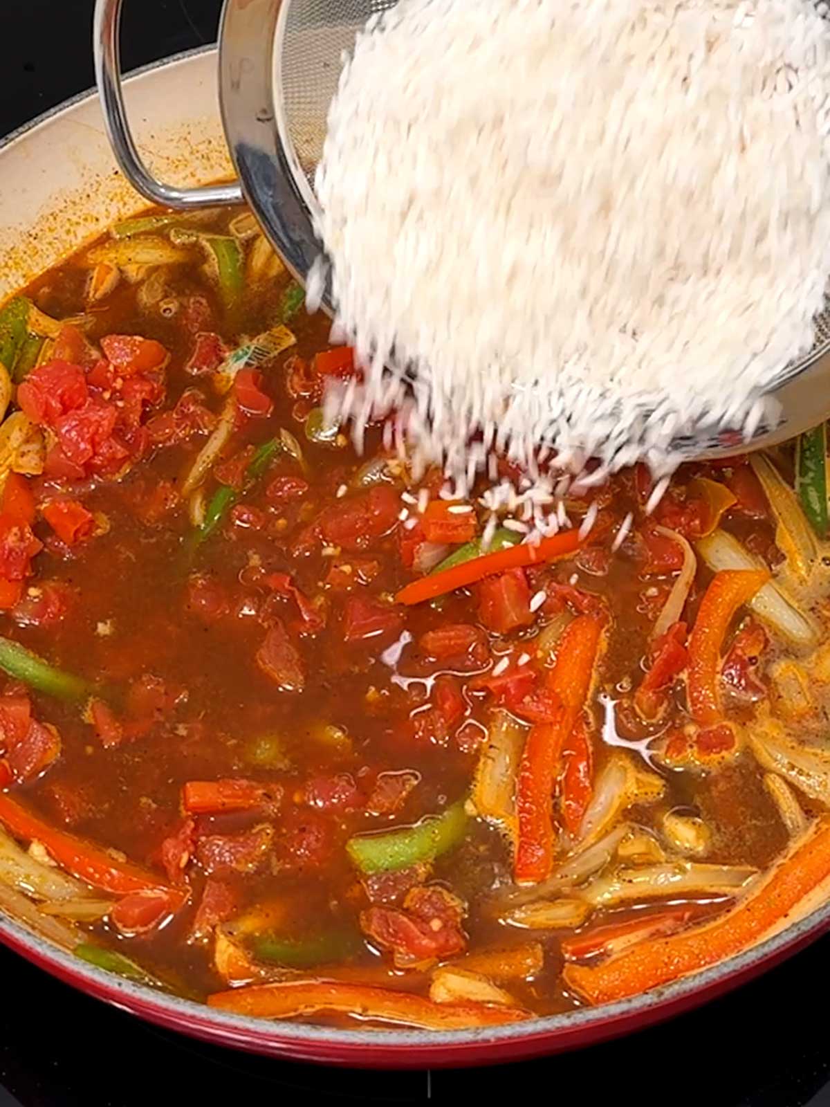 Adding rice to the one-pot chicken fajita rice mixture.