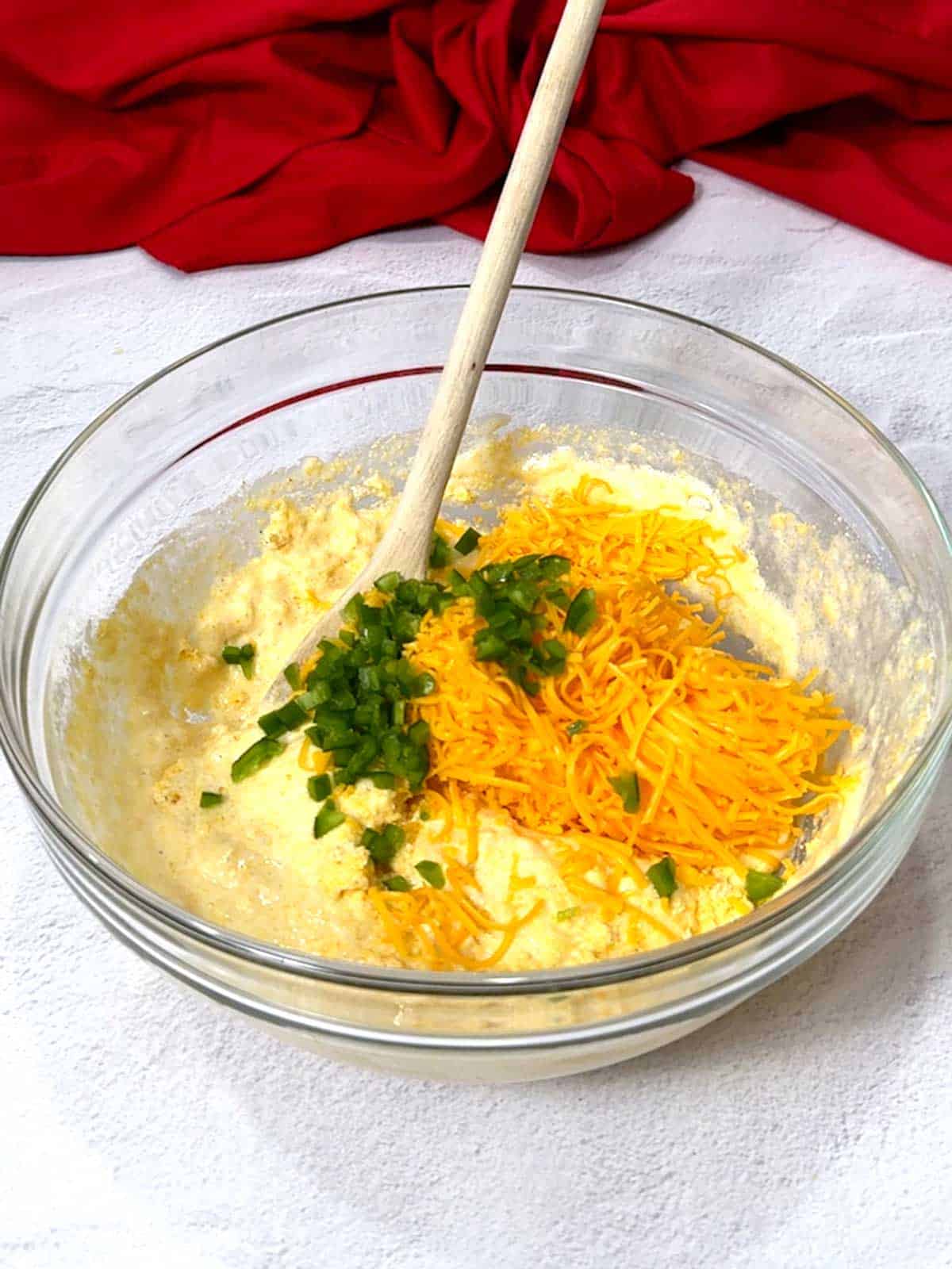 Shredded cheese and diced jalapeños added to the cornbread stick batter.