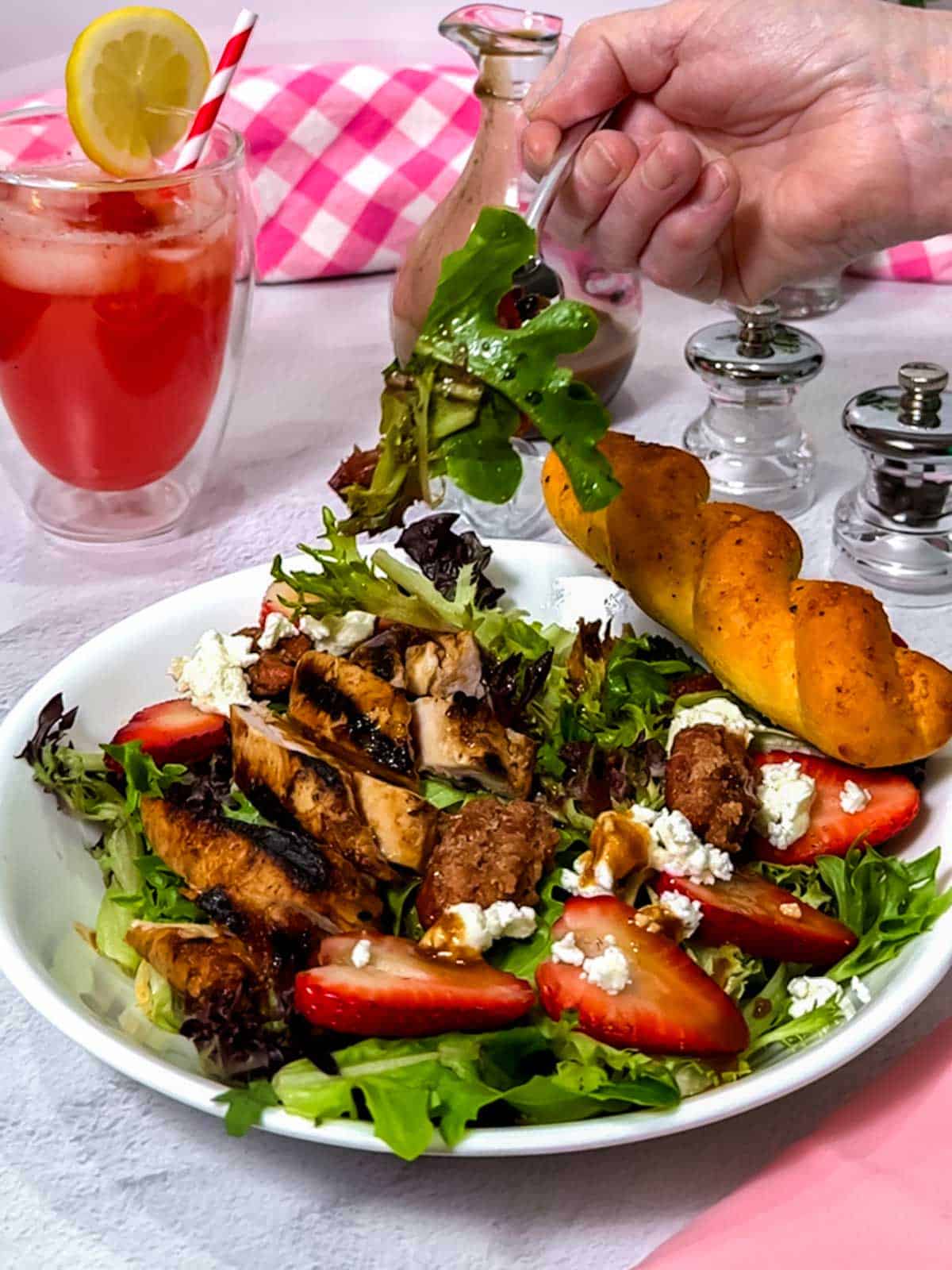 Eating the salad.