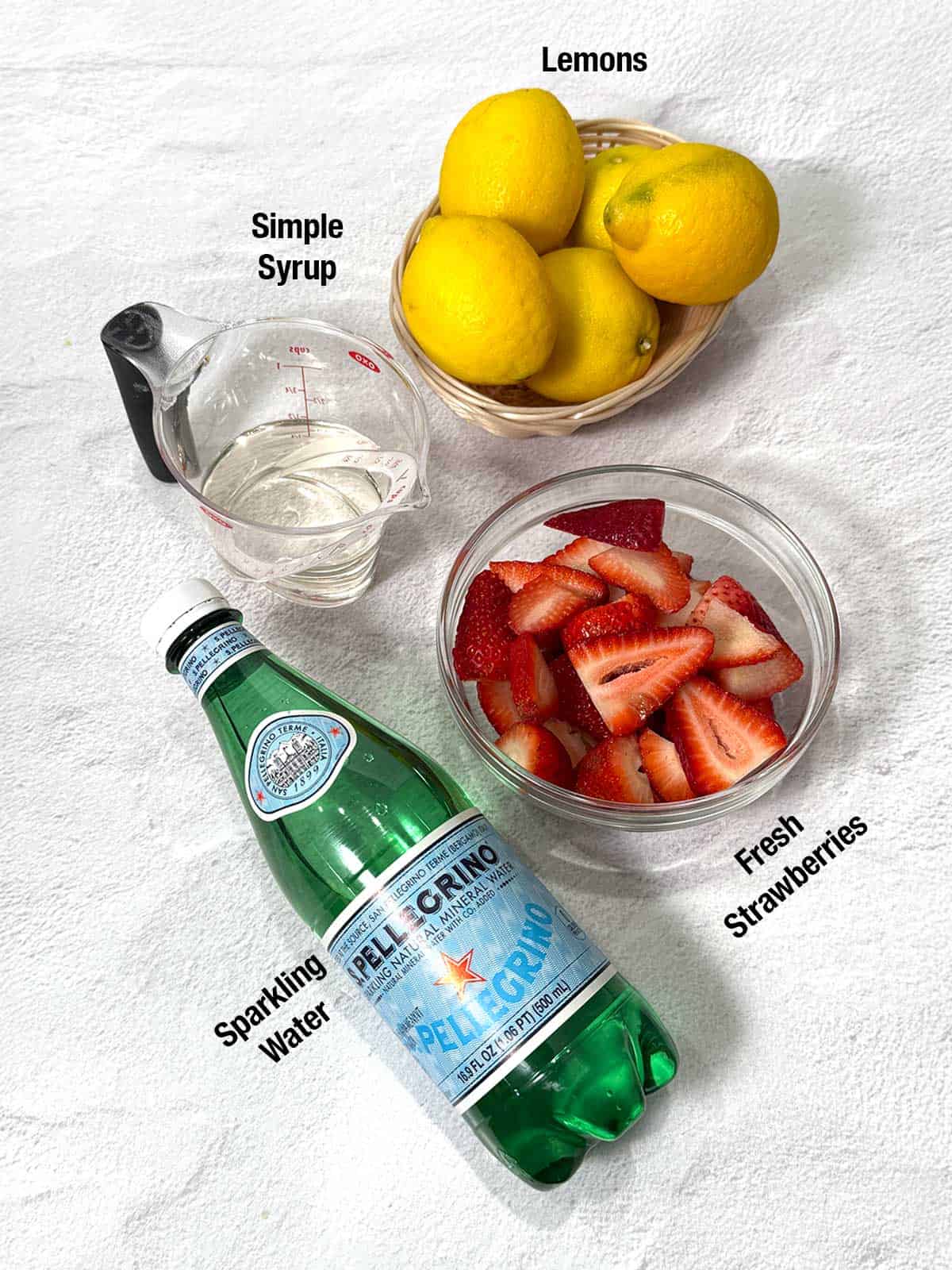 Ingredients for strawberry sparkling lemonade.